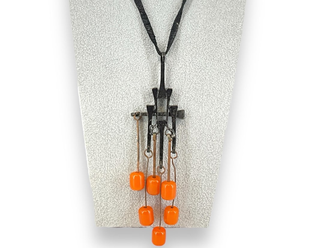 Artsy Bakelite Necklace: Artsy Bakelite Necklace Geometric pendant composed of railroad spikes and orange bakelite beads, on a cord style chain, pendant measures (6" x 1.66")