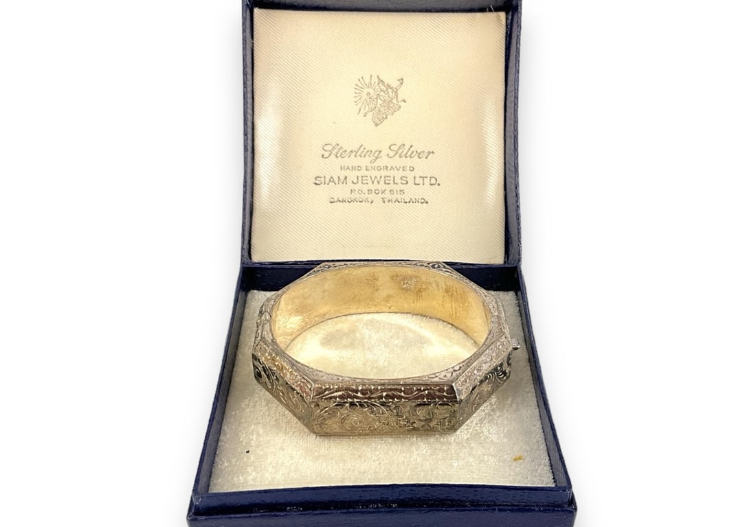 Sterling Silver Bangle: Sterling Silver Bangle From Siam Jewels Ltd., in original box/packaging, stamped sterling silver/925, 1.13 troy ounces total weight, 18.0mm in width, 2.25" interior diameter (oval shaped interior