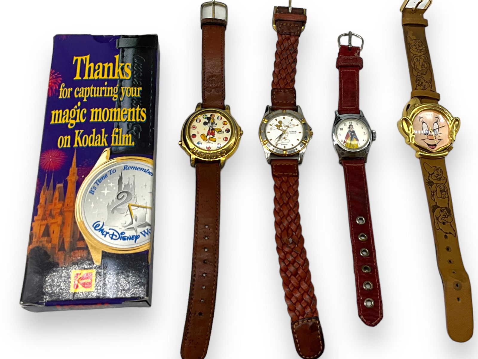 Vintage Disney Wrist Watches: Vintage Disney Wrist WatchesLorus Mickey wrist watch with country flags for the numbers, seven dwarves wrist watch with stamped band, Cinderella wrist watch, 25th Anniversary wrist watch and one more