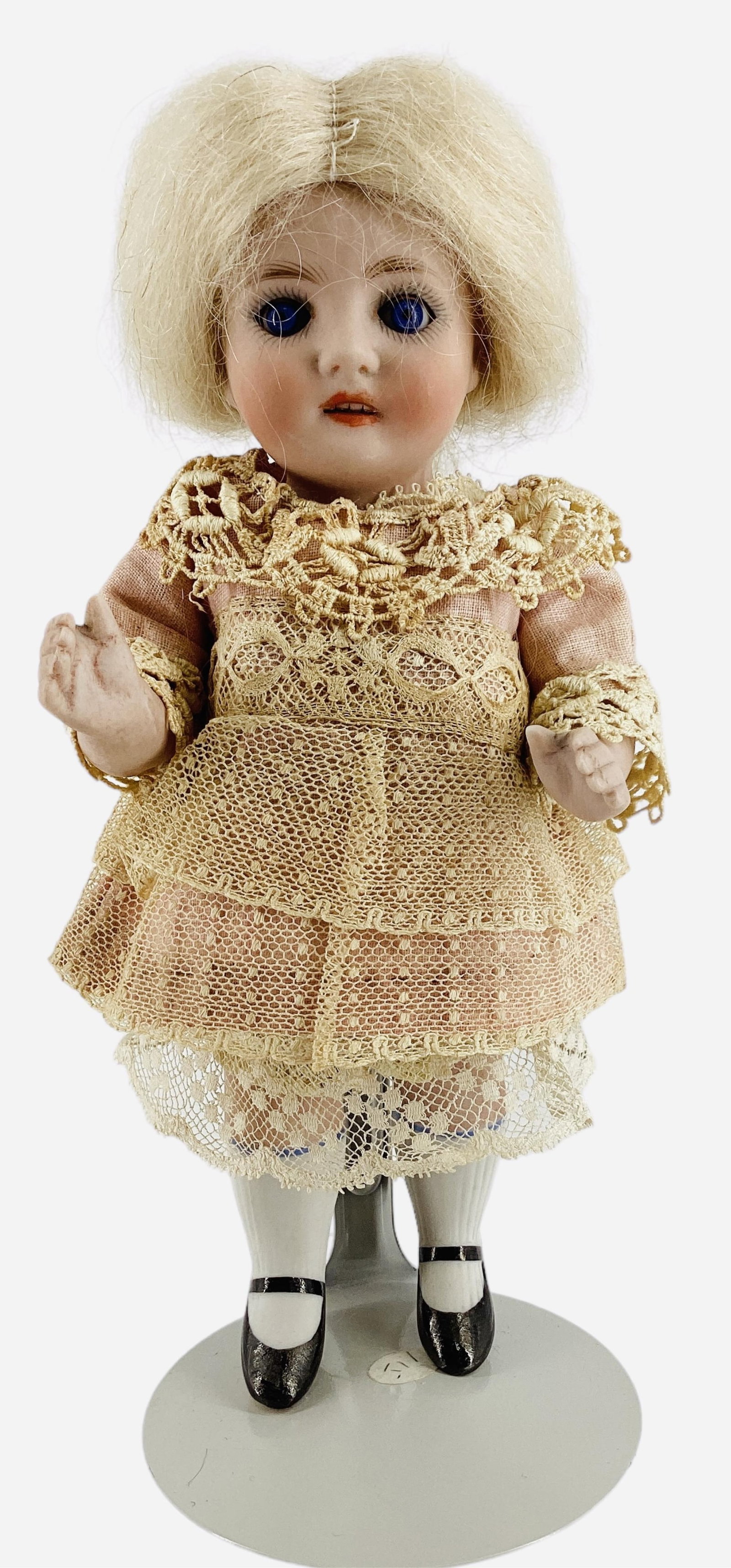 Kestner 130 All-Bisque Girl.: Kestner 130 All-Bisque Girl. 7" doll with mohair wig, glass sleep eyes, open mouth with teeth, one-piece head/torso, string jointed arms and legs with molded and painted shoes and stockings. Bisq