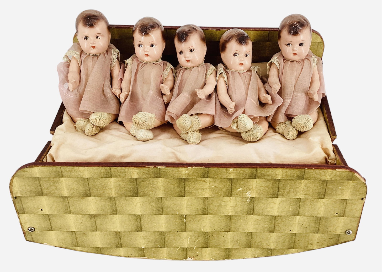 Freundlich 7" Dionne Quints in "Cradle turns Table": Freundlich 7" Dionne Quints in "Cradle turns Table" All composition dolls with molded, painted hair & facial features. Stringing is good, there is some paint missing in the eyes of several. There are 