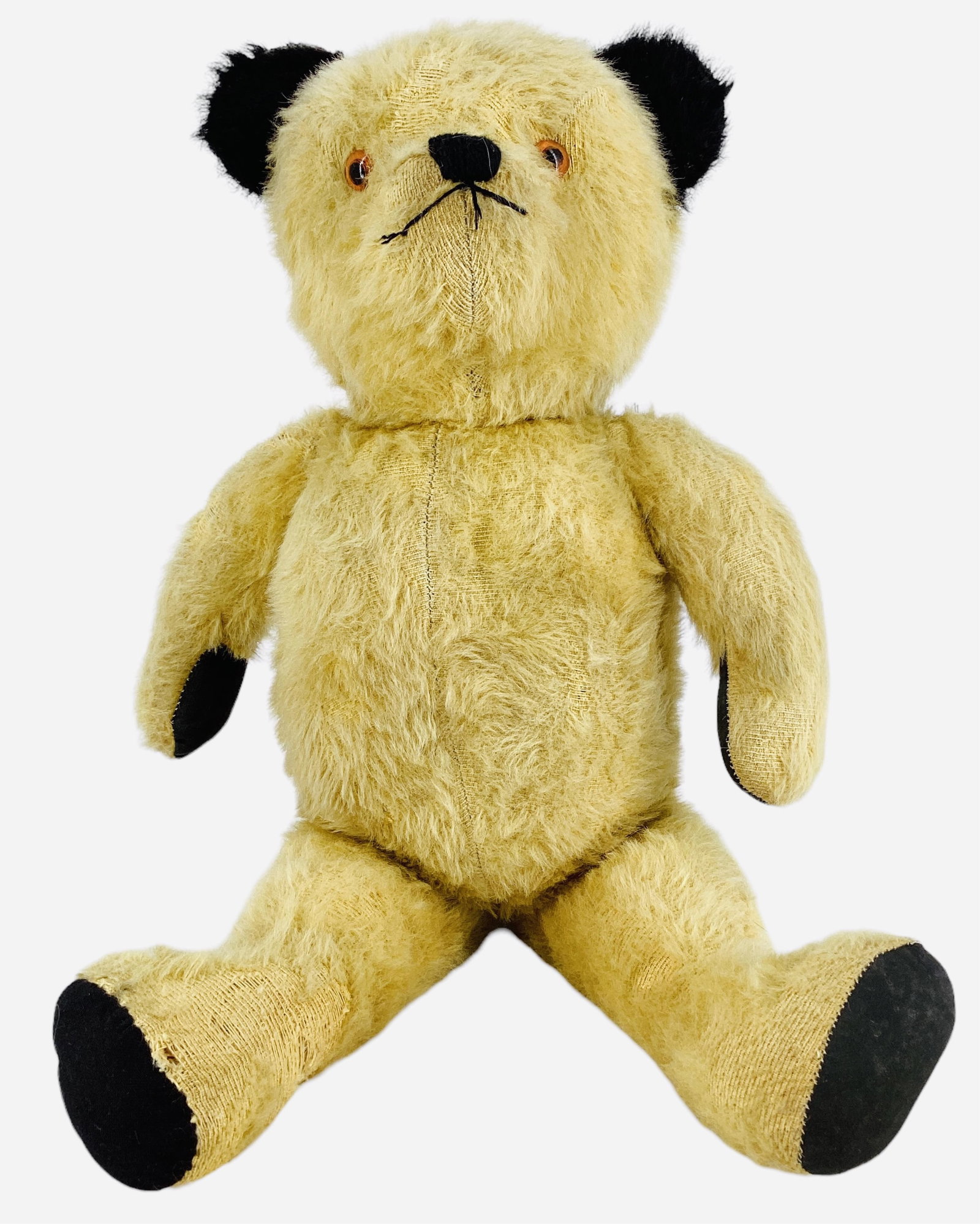 Vintage English "Sooty" Bear.: Vintage English "Sooty" Bear. 18 1/2" jointed mohair bear with applied black ears, plastic eyes, stitched nose and mouth, black cloth paw pads. Based on the British children's televisio