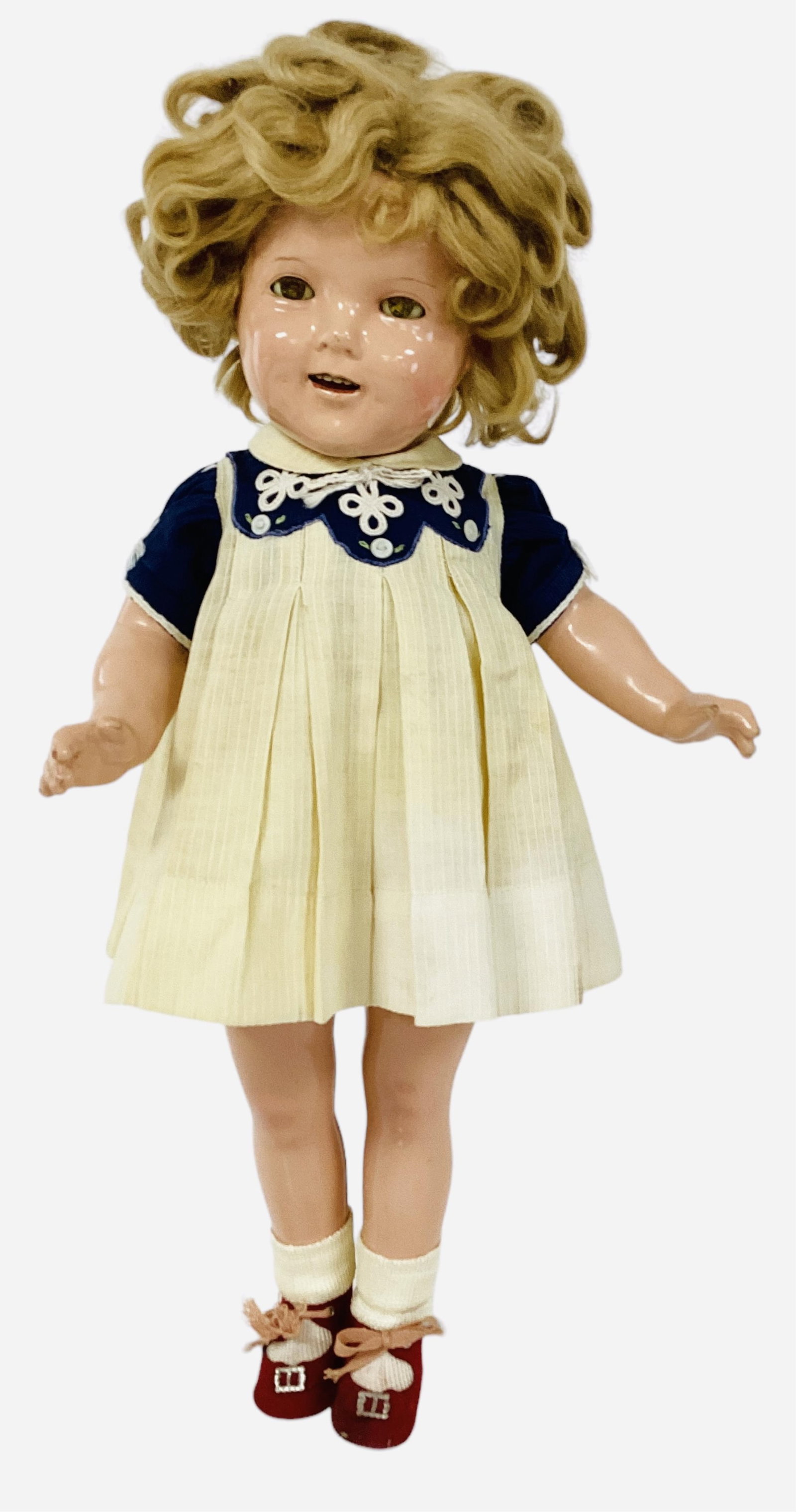 Ideal "Shirley Temple".: Ideal "Shirley Temple". 20" composition doll with mohair wig, sleep eyes, open mouth with teeth, on five-piece composition body. Shirley wears her "Our Little Girl" dress, rep