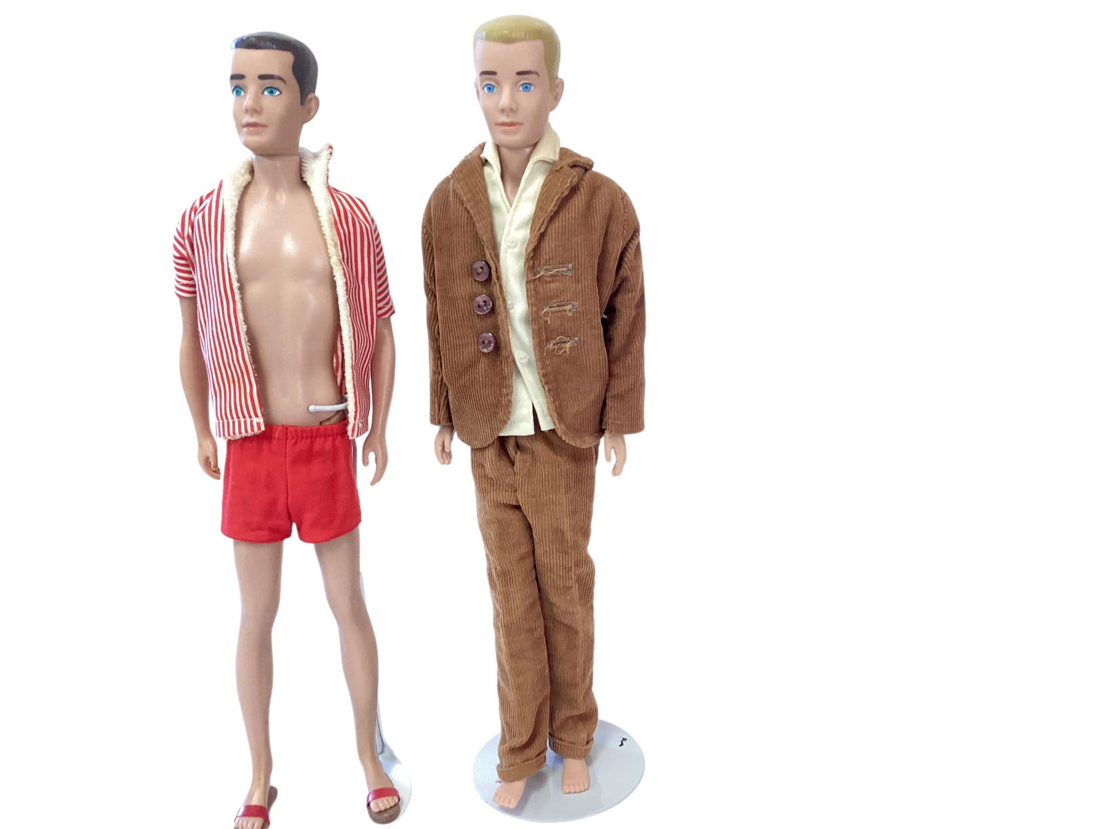 Brunette Ken Doll and Blond Ken Doll: Brunette Ken Doll and Blond Ken Doll(2) Ken dolls including (1) brunette painted hair with tiny paint rubs, beautiful turquoise eyes and clean body. Ken comes wearing his swim trunks, red striped swim