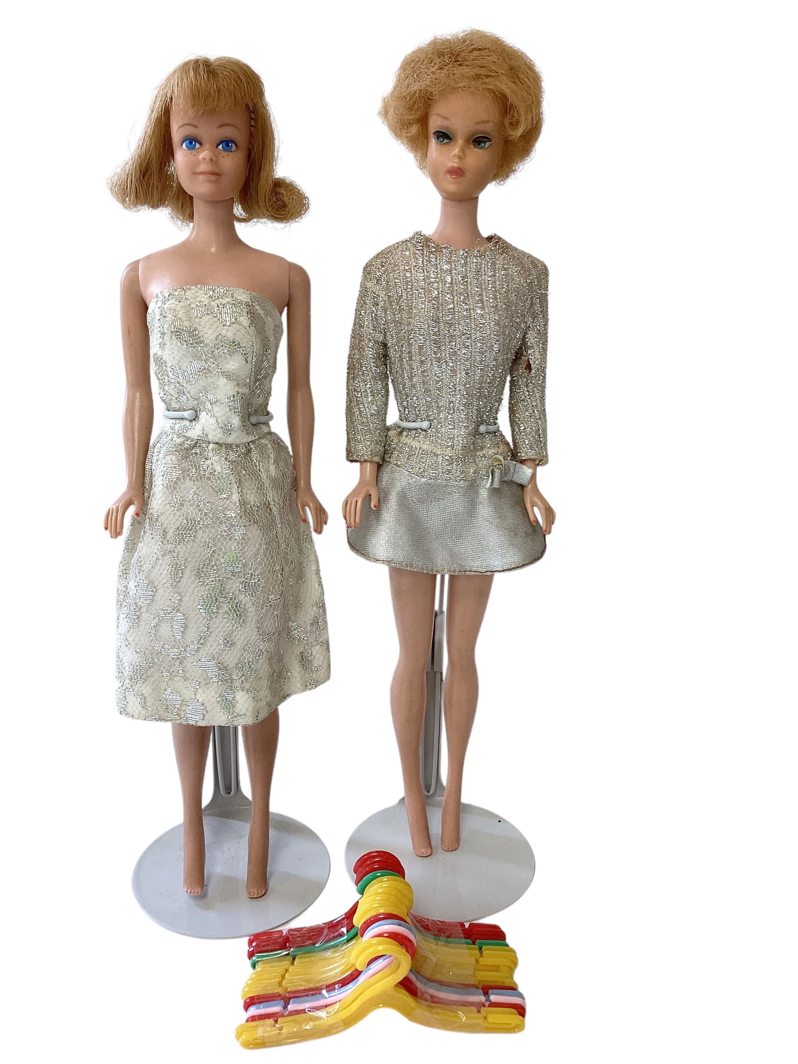 Bubblecut Barbie Doll and midge Doll and set of Hangers: Bubblecut Barbie Doll and midge Doll and set of Hangers(3) including (1) Blond Bubblecut Barbie - fingernails and some of her toes have been polished - no green ear or neck spits - some small scratche