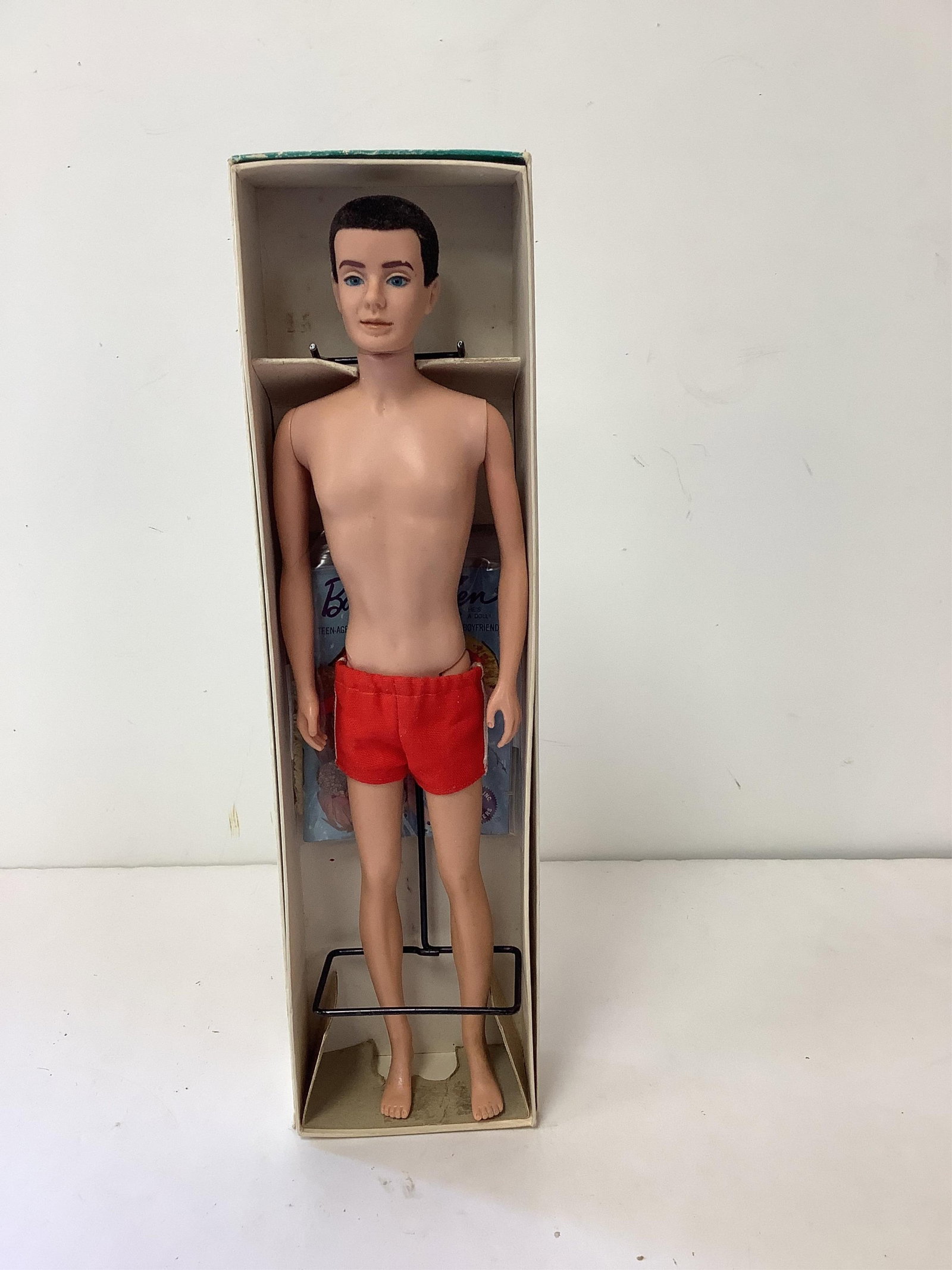 Excellent Ken Doll With Original Box: Excellent Ken Doll With Original Box (1) brunette flocked Ken doll with no hair rubs, bright blue eyes - very nice body - one eyebrow is slightly different than the other which appears to be a factory