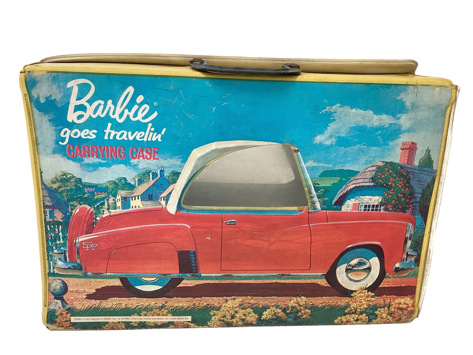 Barbie Goes Travelin' Case: Barbie Goes Travelin' Case(1) Barbie Goes travelin' Case shows an airplane on one side and a vintage red car on other side. Barbie sits in blue seat inside and the can see out of both windows. Graphic