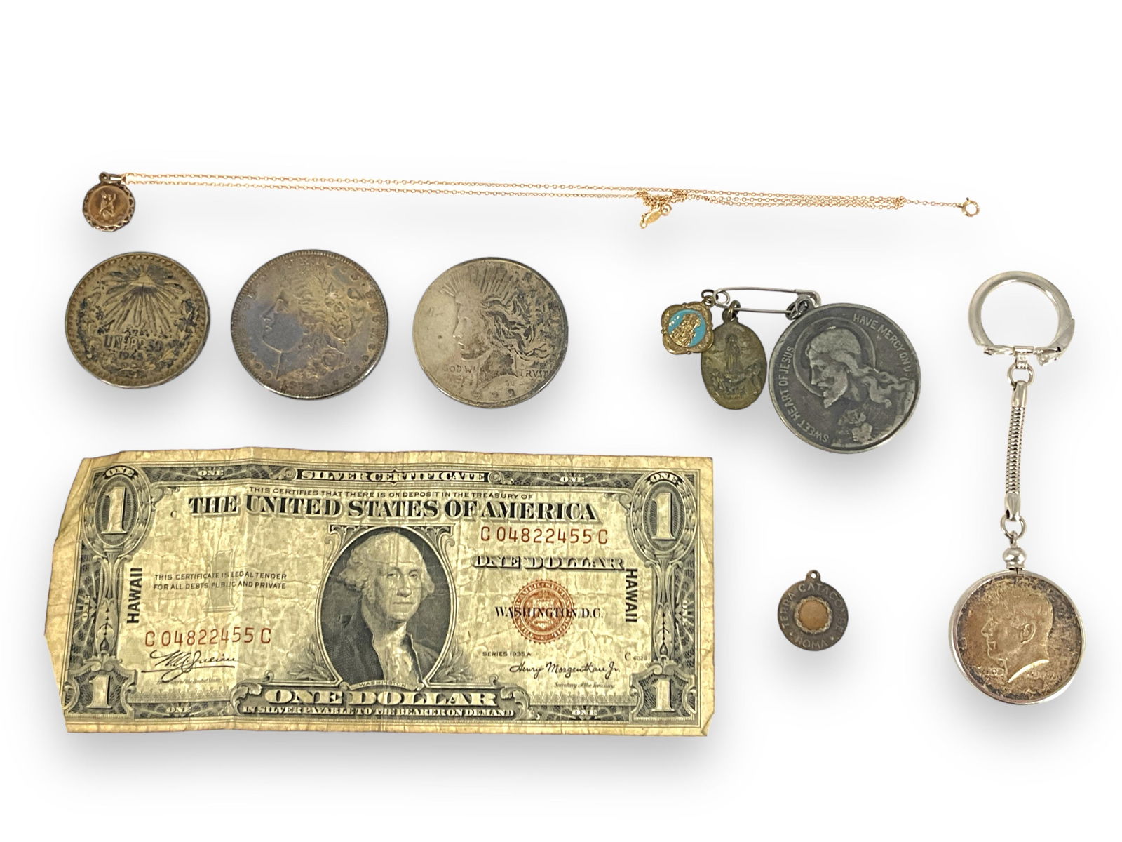 U.S. and Foreign Coins + Bill, Keychain and Necklace: U.S. and Foreign Coins + Bill, Keychain and NecklaceTwo U.S. silver dollar coins (Peace and Morgan dollar coins, Morgan dated 1878 - 7 feather type), 90% fine silver Kennedy half dollar coin dated 196