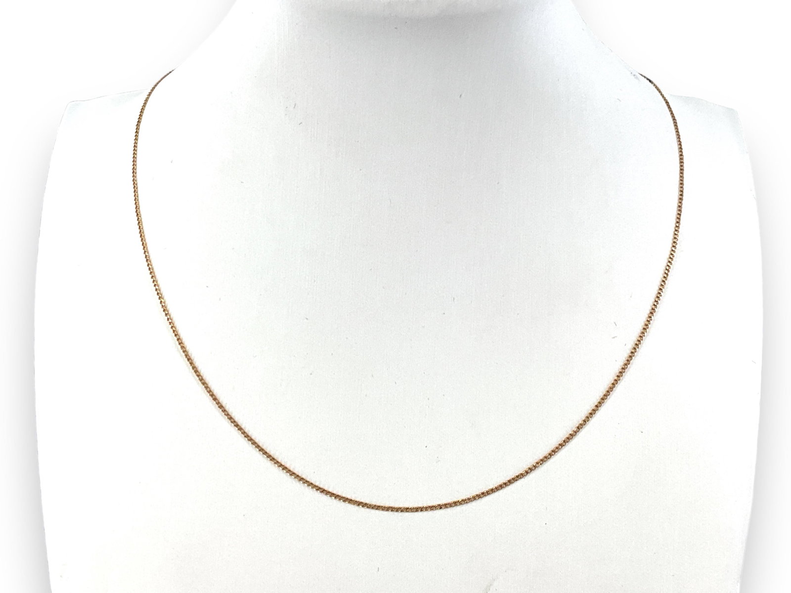 14kt Yellow Gold Necklace: 14kt Yellow Gold Necklace Stamped and tested 14kt yellow gold, spring ring clasp closure, 1.0 grams total weight, 1mm chain width. 16" choker length.