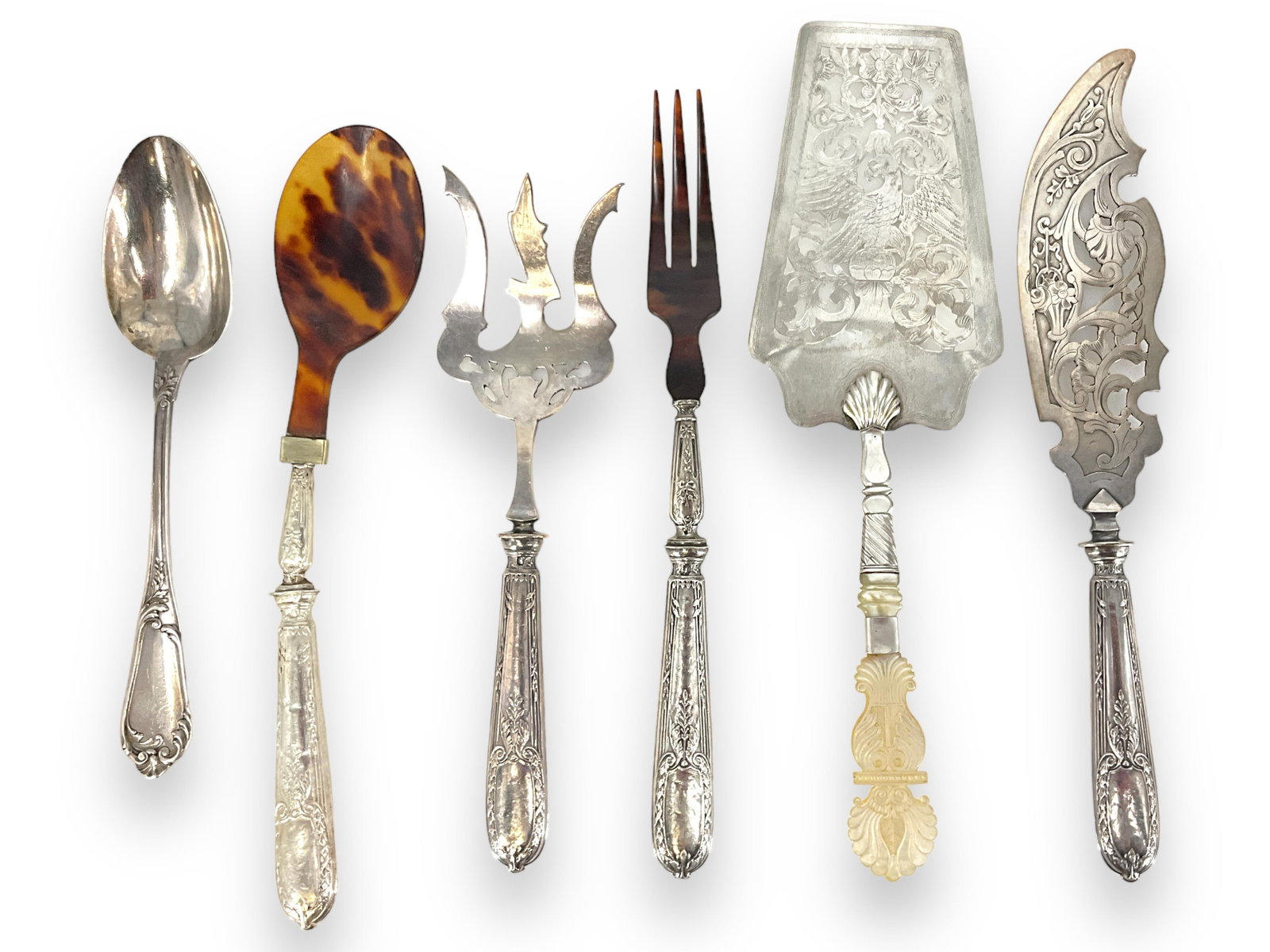 Silver-Plated Serveware: Silver-Plated ServewareSix pieces in total including an ornate pie server with a carved mother-of-pearl handle, imitation shell-type serving fork and spoon set (damaged), perforated seafood/fish knife