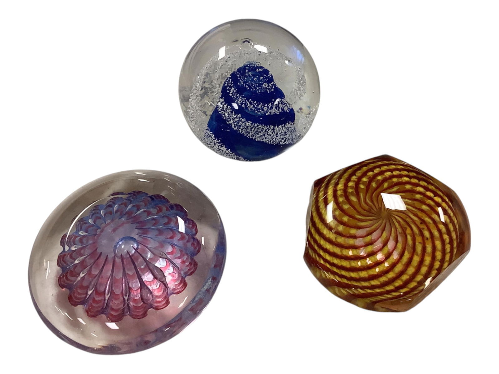 Glass Paperweights: Glass PaperweightsSizes range from 3" to 4". Slight chip on top of indigo swirl.