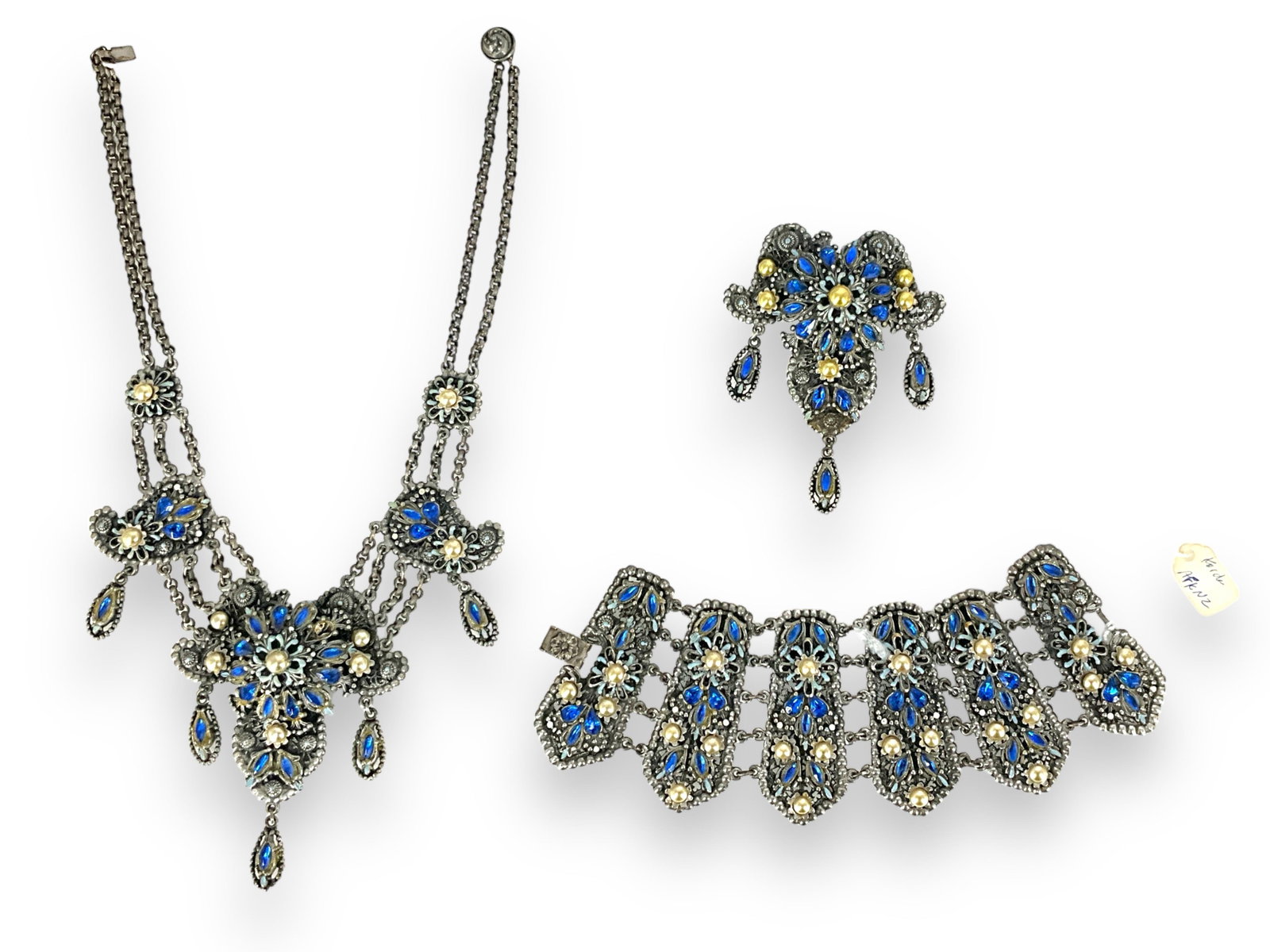 Spectacular Korda, Thief of Bagdad, Vintage Parure: Spectacular Korda, Thief of Bagdad, Vintage Parure This suite of jewelry is hallmarked "Thief of Bagdad, Korda" and is created in decorative silver-tone metal, faux pearls, blue enamel and blue fashio