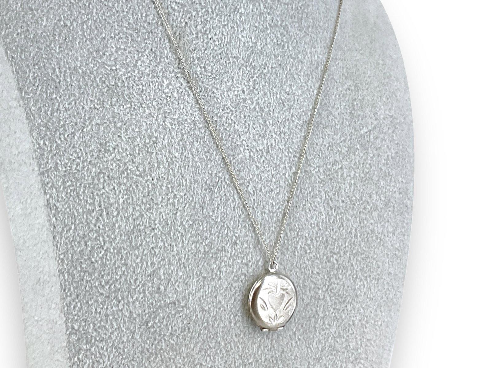 14k w/g Necklace with Silver Locket: 14k w/g Necklace with Silver Locket Necklace chain is marked and tested for 14k white gold, is approx 16" long and holds a tested 84 parts silver locket which is round in shape, approx 3/4" tall and h