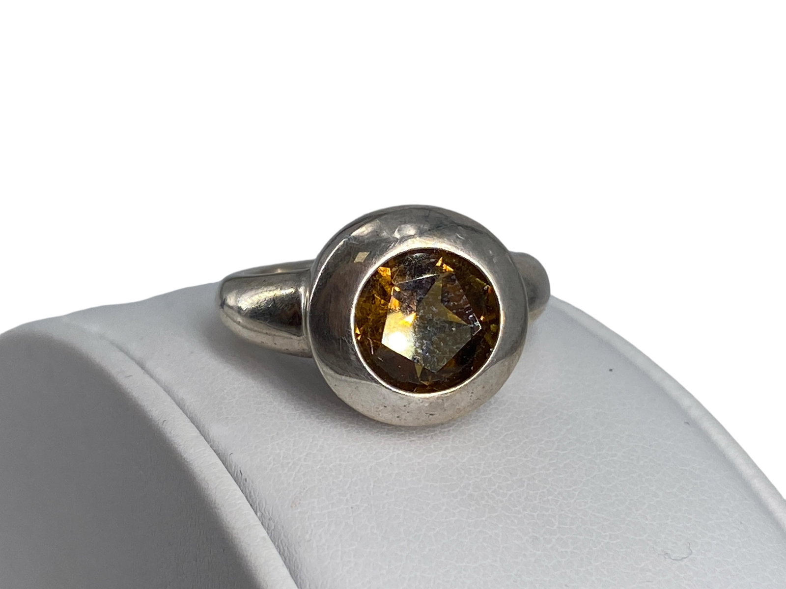 Silver and Citrine Stone Ring: Silver and Citrine Stone Ring The ring has a center citrine in a round cut @ approx 8mm (approx 1.8 carats), is hallmarked "925" for silver, is a size 9 and weighs 7.57 grams total weight - bezel set 