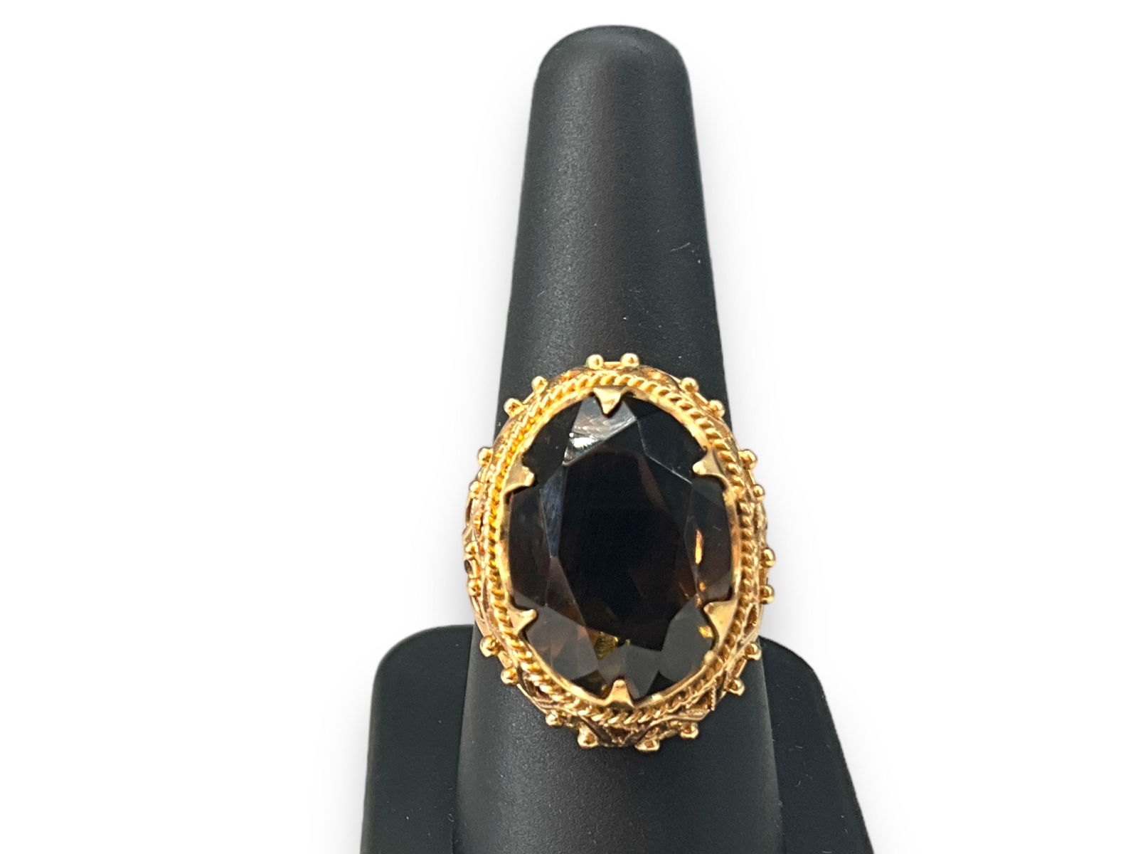 14kt Yellow Gold and Smoky Topaz Stone Solitaire Ring: 14kt Yellow Gold and Smoky Topaz Stone Solitaire RingTested 14kt yellow gold, 12.1 grams total weight, size 8.25 with a tapered/openwork shank design (semi-polished metal finish), smoky topaz center s