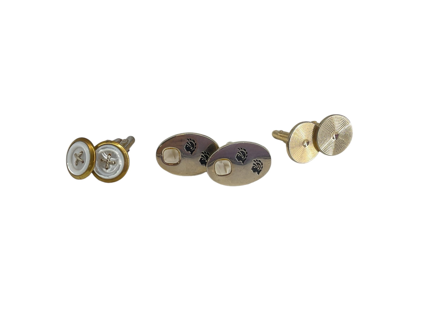 Three Pairs Of Cufflinks: Three Pairs Of Cufflinks Costume cufflinks, one pair with button motif and mother of pearl center stones, two additional styles.