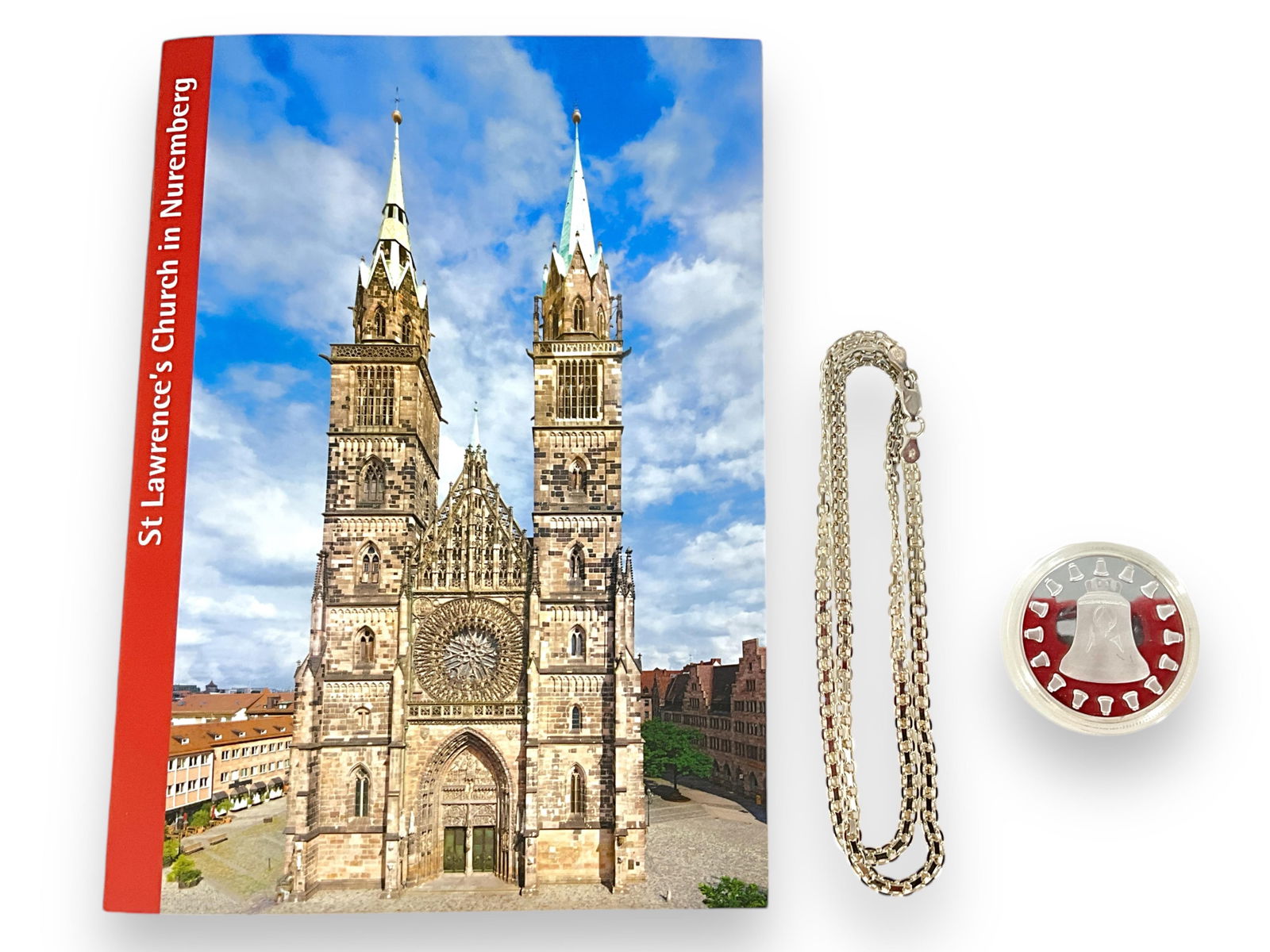 Silver-Tone Cased St. Lorenz Nurnberg Medal w/Booklet and Silver Chain Hallmarked "925 Italy": Silver-Tone Cased St. Lorenz Nurnberg Medal w/Booklet and Silver Chain Hallmarked "925 Italy"Lot contains a medal in a clear plastic case which tests copper and zinc (only tests 4 parts silver), the m