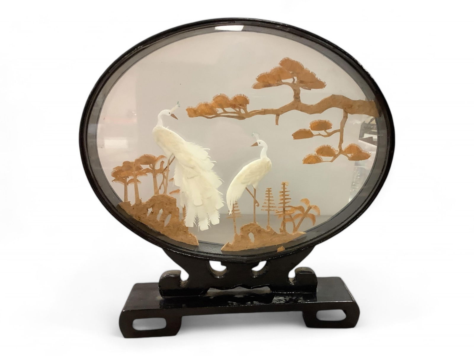 Asian Diorama and Vintage Trivets: Asian Diorama and Vintage TrivetsCarved wood diorama with peacocks and trees. 11.75" tall x 11.25" wide.Pair of matching trivets, starburst with heart shaped handle. 5" at widest point and 8.5" long.