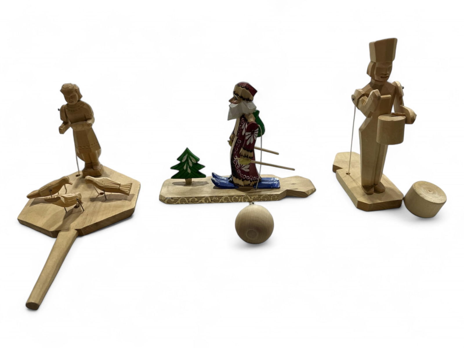 Hand Carved Wooden Russian Pull Toys: Hand Carved Wooden Russian Pull Toys3 toys. Santa, soldier drumming and a girl feeding birds. Pull the string and watch the toy come alive! Approx 4.5"-7" long