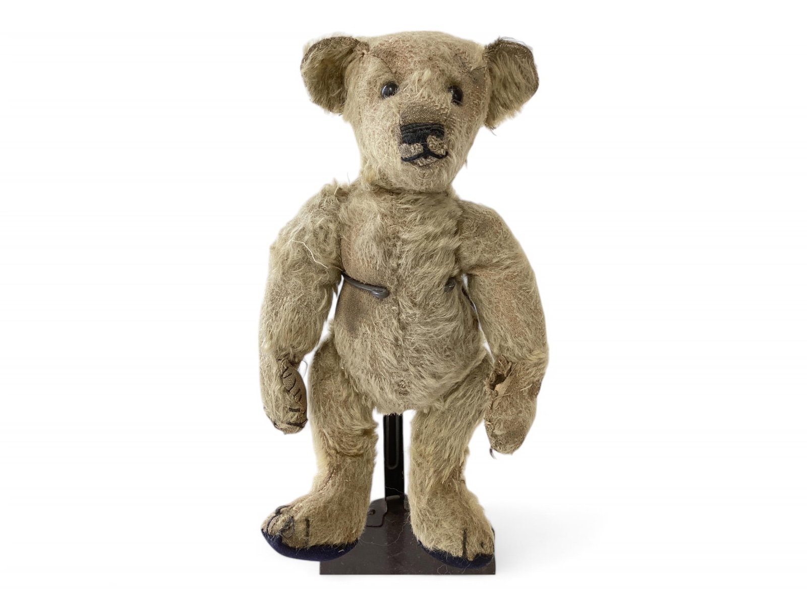 Antique Bruin Bear.: Antique Bruin Bear. Circa 1907-08, 10 1/2" mohair bear with applied ears, shoe button eyes, stitched nose and mouth, disk jointed head, arms and legs. Left ear partially detached, paw pads replac