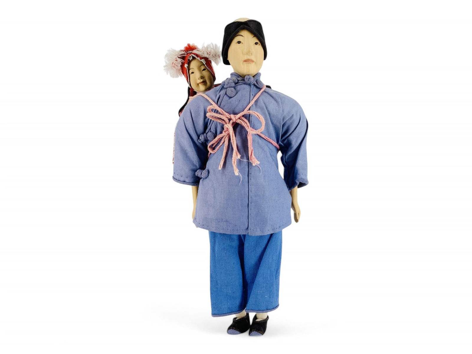 Door of Hope "Amah" doll carrying a baby on her back. (1 of 4)
