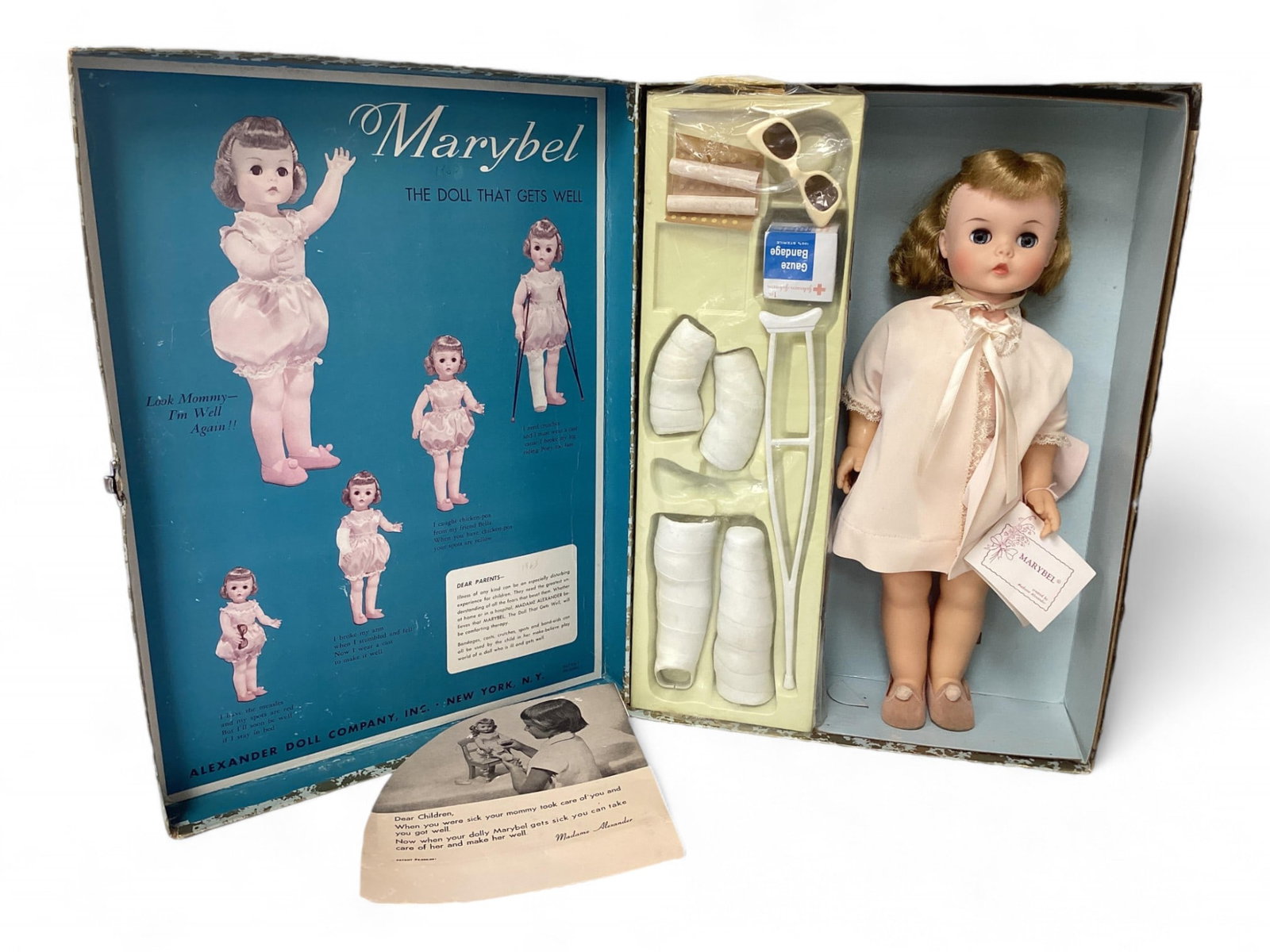 Madame Alexander "Marybel The Doll That Gets Well", with Original Box: Madame Alexander "Marybel The Doll That Gets Well", with Original Box 15" tall, vinyl head, hard plastic body, rooted hair, sleep eyes with lashes, jointed head, arms, legs. Outfit is robe, one piece 