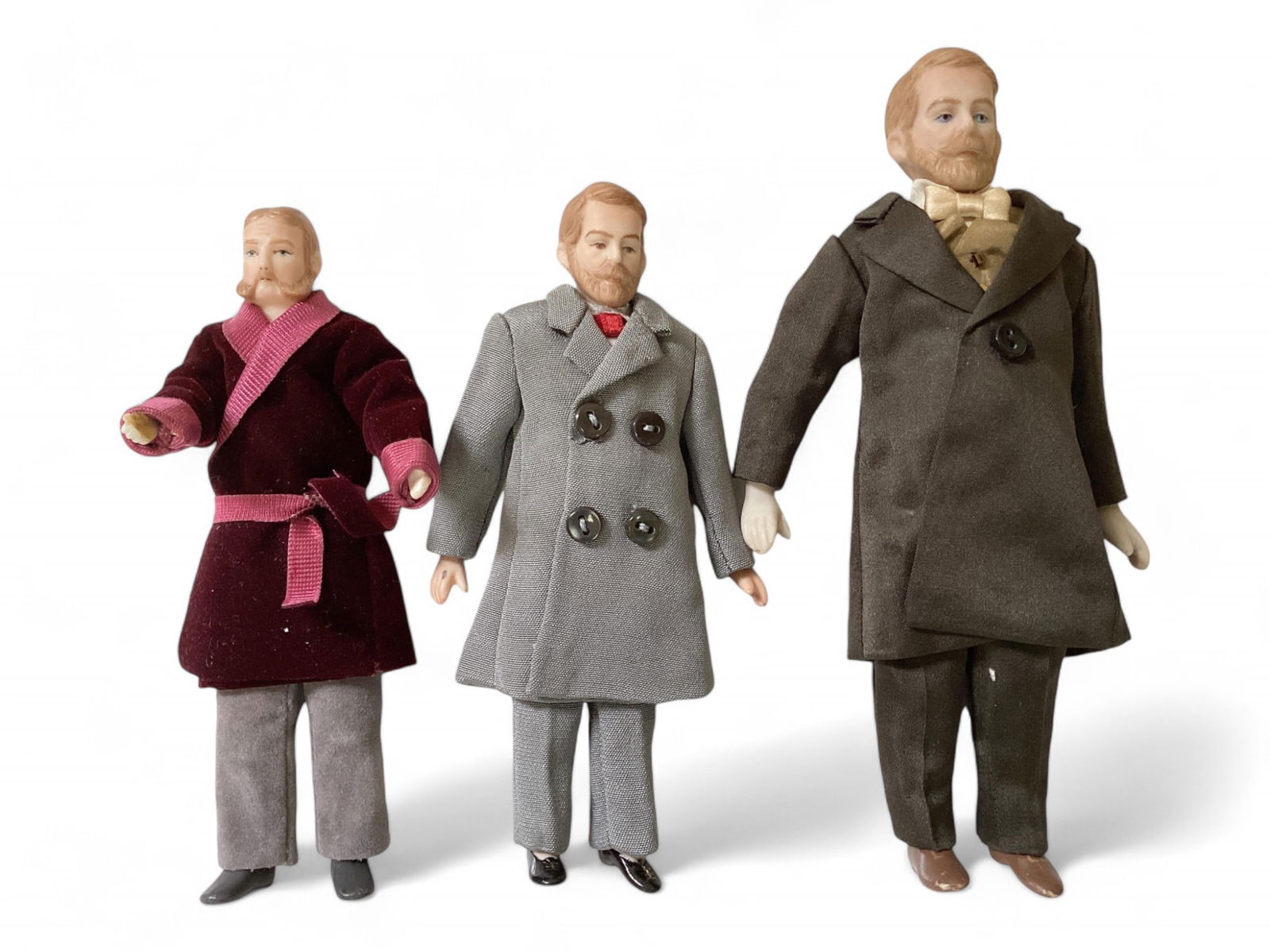 3 Porcelain Edwardian Dollhouse Figures: 3 Porcelain Edwardian Dollhouse Figures5-3/4" porcelain shoulder head, lower arms, legs, soft stuffed body, slightly posable arms. Was holding something in his hand. 6" string jointed arms, legs. 7" s