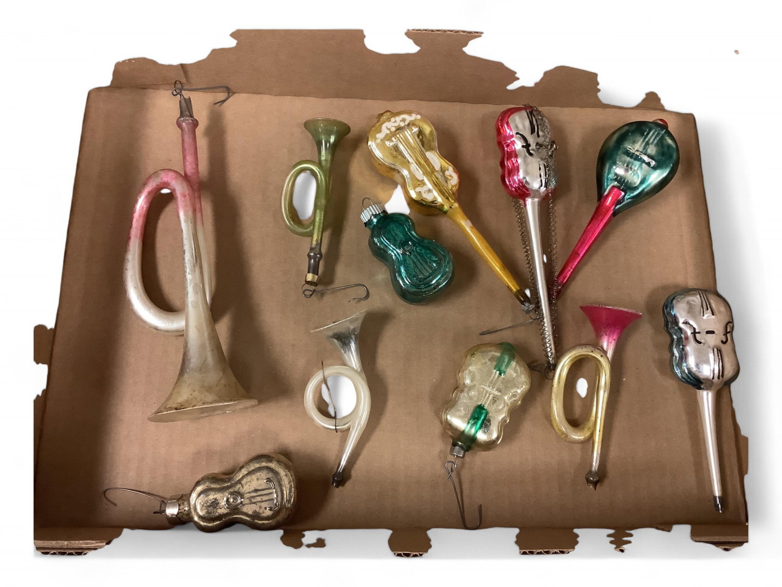 Vintage Musical Themed Glass Ornaments: Vintage Musical Themed Glass OrnamentsNice glass ornaments in the shape of musical instruments. Variety of colors.