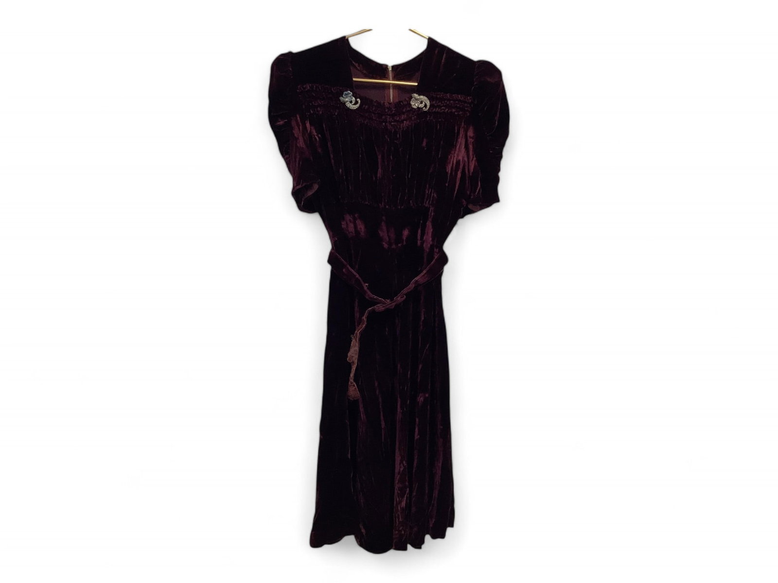 Vintage Claret Velveteen Dress: Vintage Claret Velveteen Dress Squared neckline with ruching to gather material across bust, rhinestone accents at neck and matching belt. Sleeves are puffed and ruched. 14" across back at shoulders, 