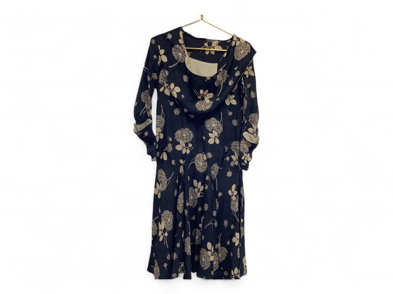 Black and Gold Floral Silk Dress: Black and Gold Floral Silk Dress Drop waist with flared skirt, embellished belt, contrasting modesty panel and attached scarf. Sleeves are uniquely constructed with a contrasting "pocket" on the outsi