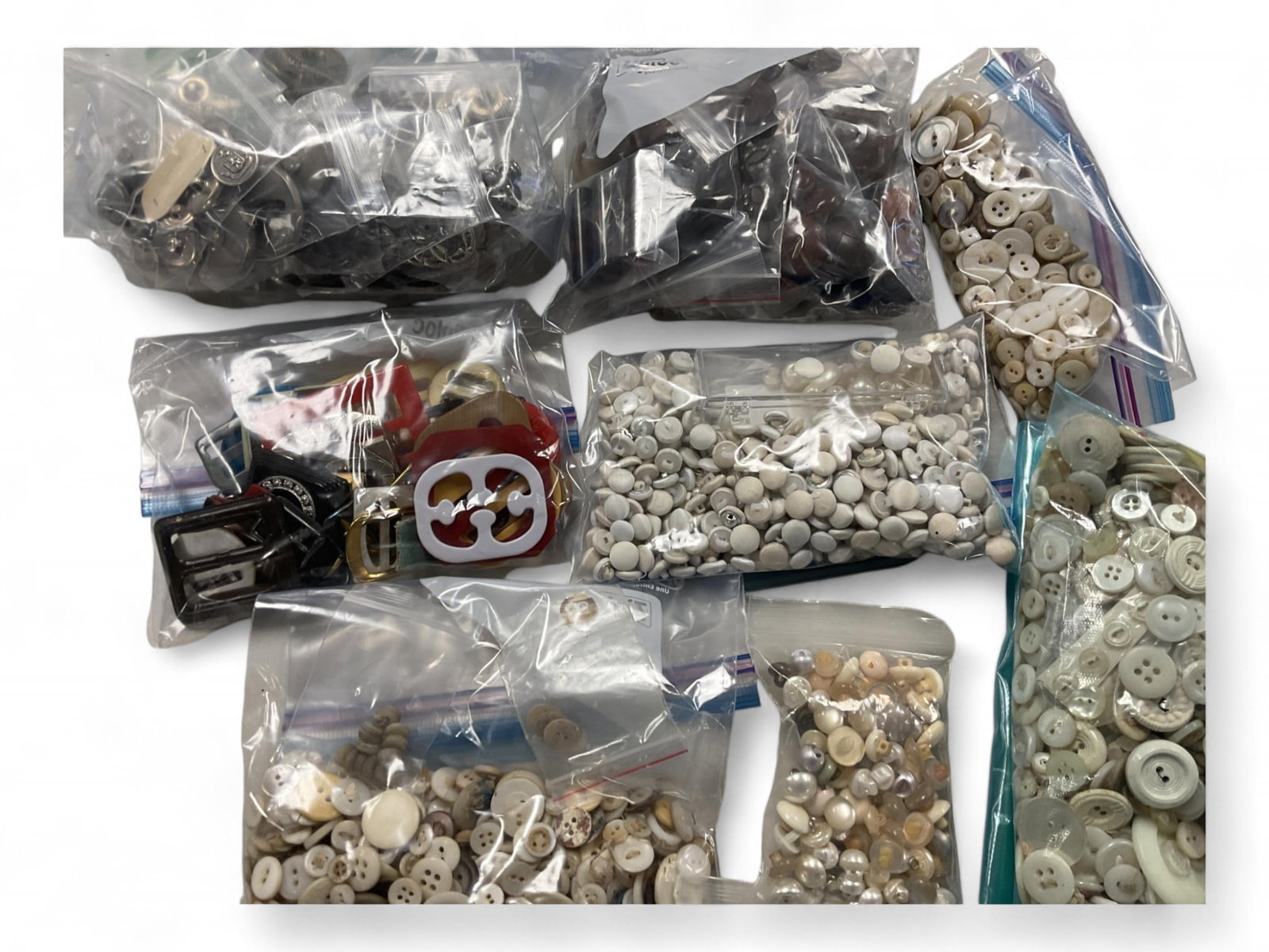 Variety of Buttons: Variety of Buttons (9) bags and (7) individual small bags. All sizes and texture.