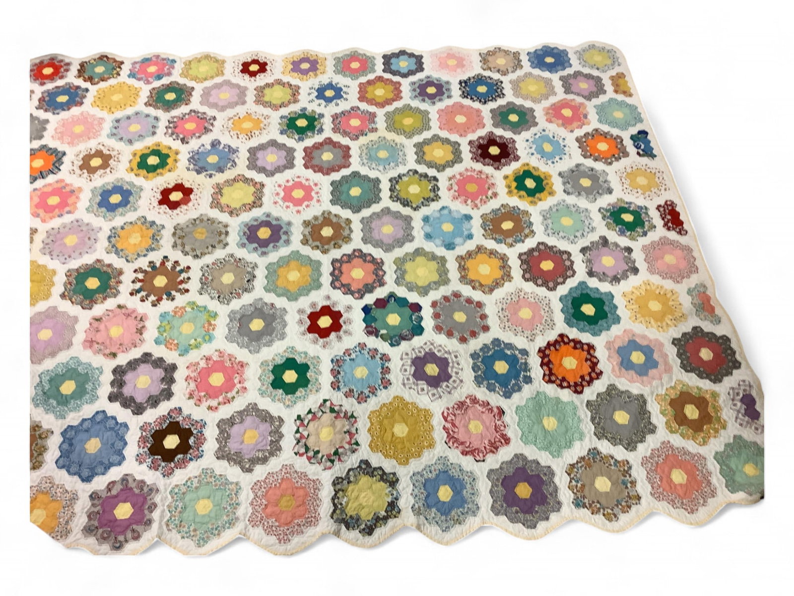Vintage Quilt: Vintage Quilt Grandma's Flower Garden patter, 80" x 98". One small water stain, otherwise good condition.