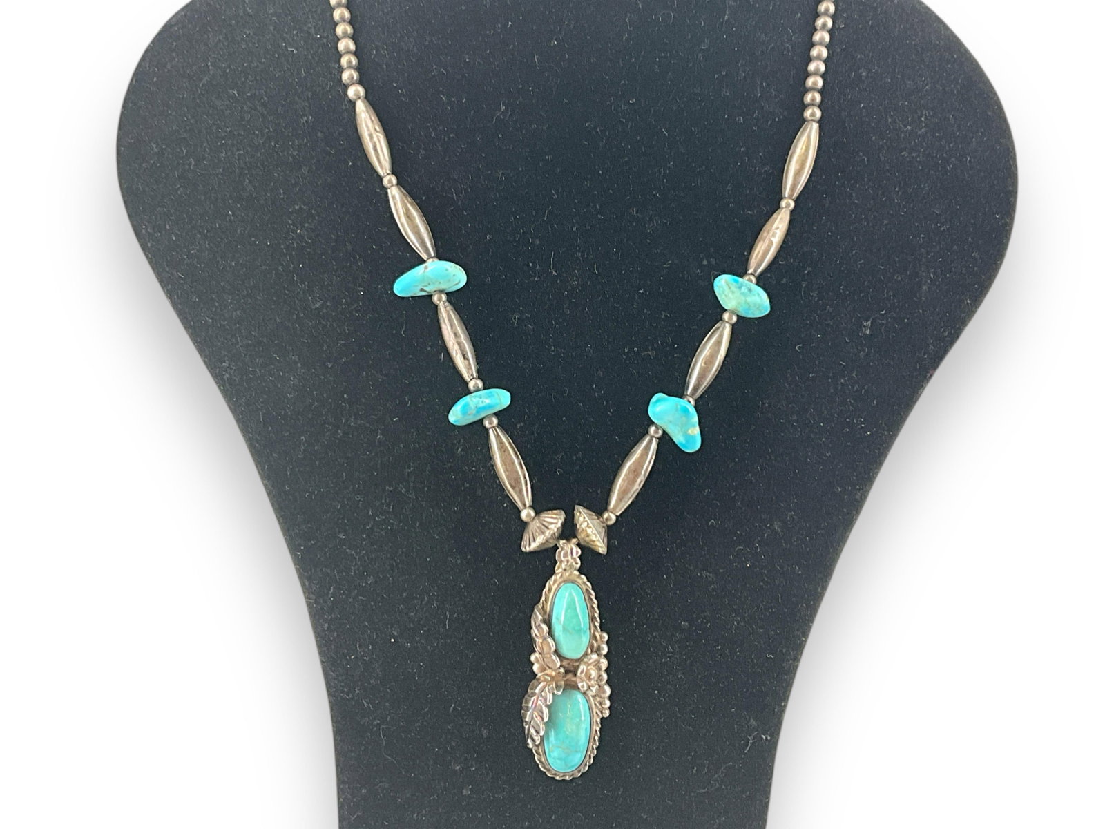 Southwestern Sterling Silver Necklace with Turquoise Stones: Southwestern Sterling Silver Necklace with Turquoise Stones Necklace and pendant test as sterling silver, 18" princess length, hook-clasp closure, 33.8 grams total weight, with polished and tumbl