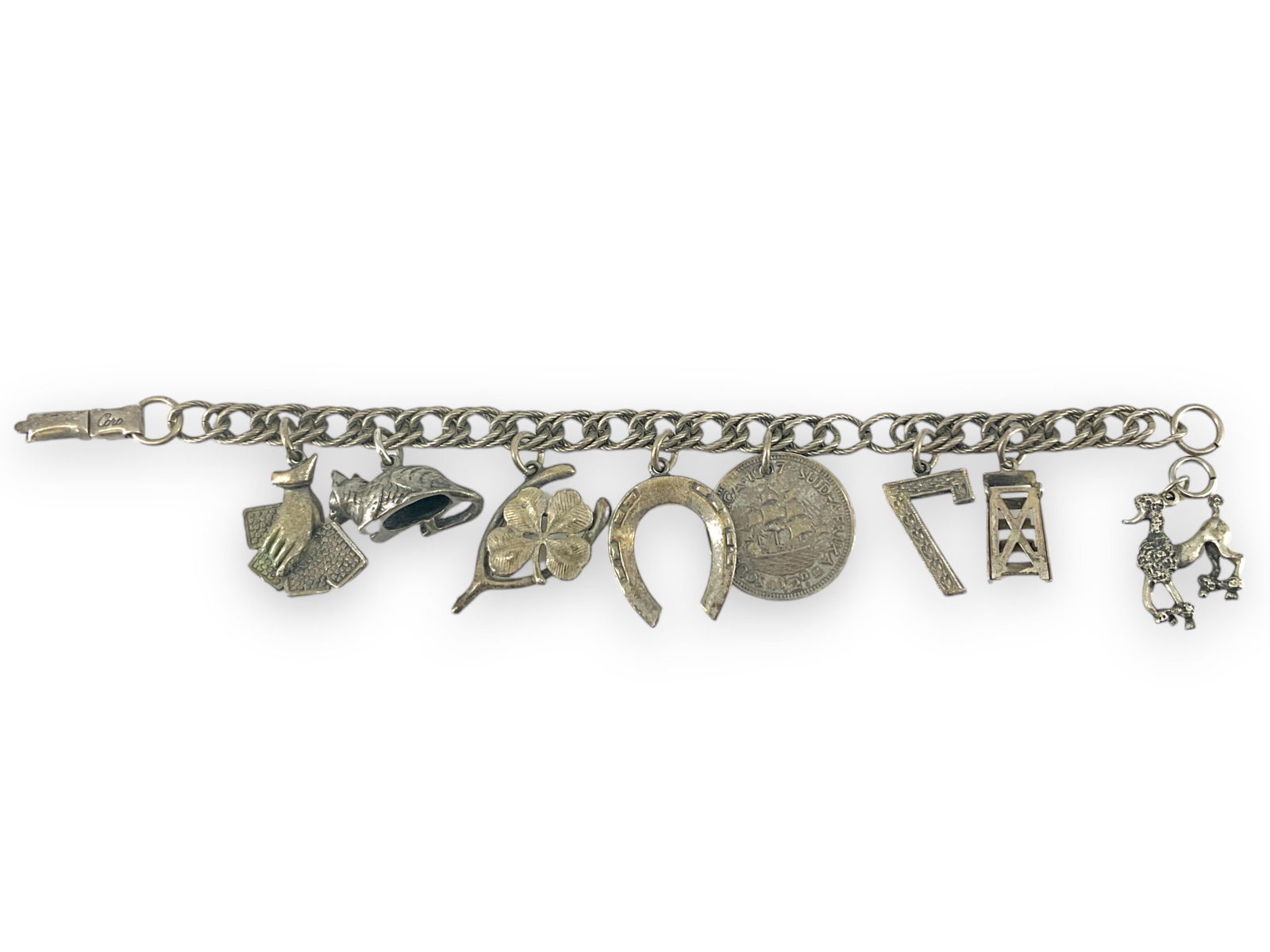 Vintage Coro Charm Bracelet: Vintage Coro Charm BraceletSome silver composition (tests around 50% silver - silver composition not guaranteed - bid with discretion based on your own observations), signed Coro on clasp, with charms