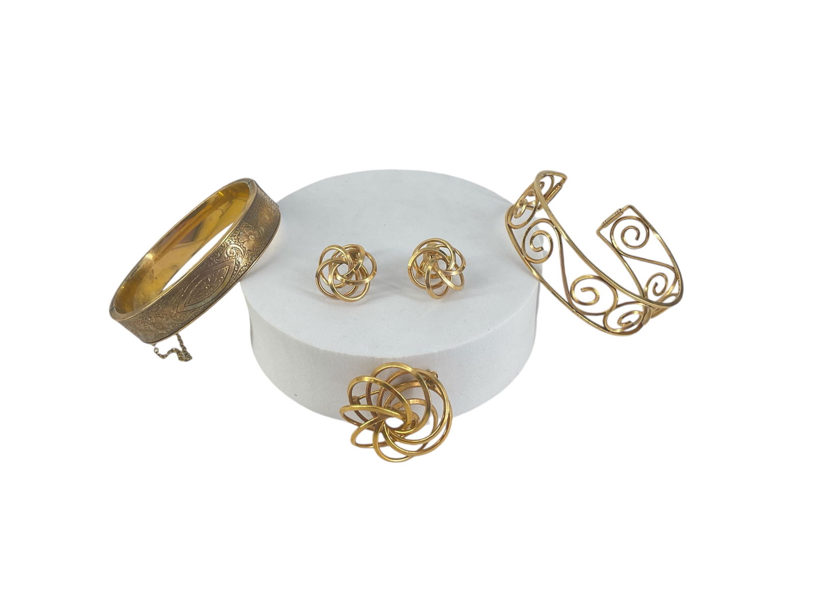 Gold Filled Accessories: Gold Filled AccessoriesOne demi parure with screw-back earrings and matching pin (1.17") in diameter, bracelet from Kermitz inner diameter of (2.24") and measuring (0.75") wide, hinged bangle with flo