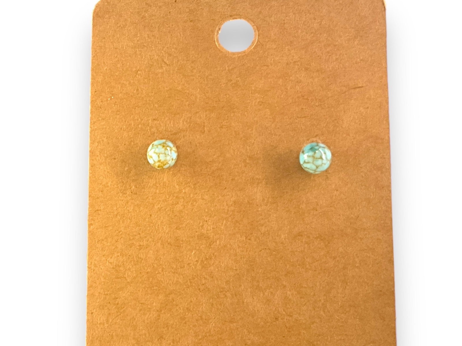 14kt Yellow Gold Stone Earrings: 14kt Yellow Gold Stone EarringsPost back earrings with (5mm) polsihed turquoise like beads with veins of gold tone mineral deposits, stamped and tested (0.7 grams tw).