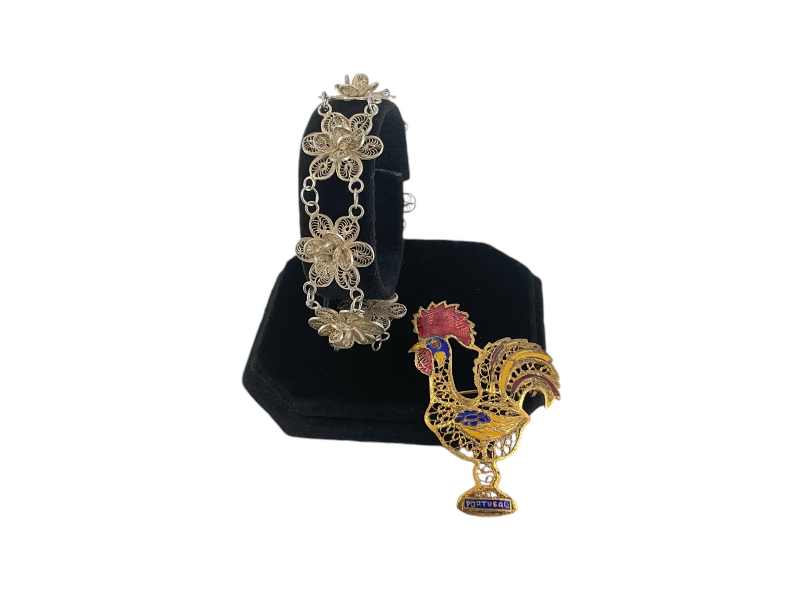 Vintage Silver Filigree Flower Bracelet and Vintage Portuguese Filigree Rooster Pin: Vintage Silver Filigree Flower Bracelet and Vintage Portuguese Filigree Rooster Pin Lot contains a bracelet created with filigreed, tested silver, metal consisting of seven floral shaped sections, bra