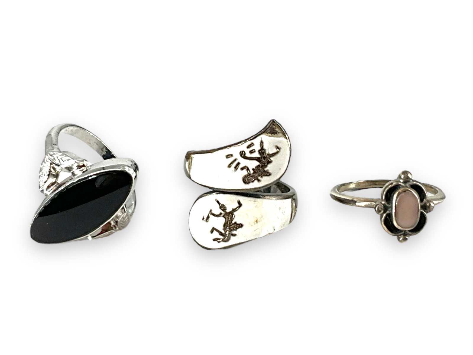 Three Rings - Onyx, Siam and Mother-of-Pearl: Three Rings - Onyx, Siam and Mother-of-Pearl First ring has a navette-shaped piece of black onyx at the center, has a mounting which tests primarily nickel and then silver, is a size 6 and weighs 2.89