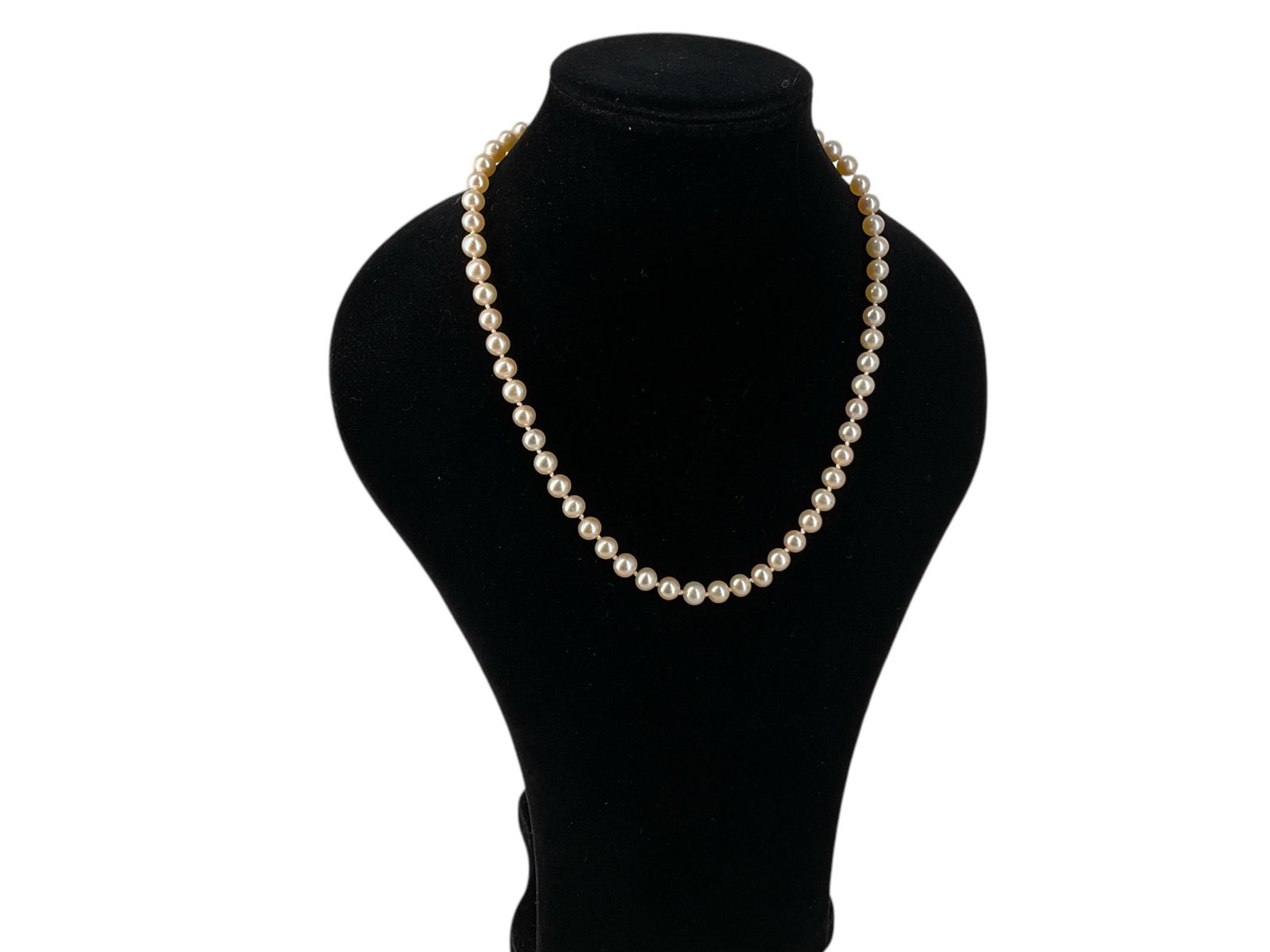 Cultured Strand of Pink Pearls: Cultured Strand of Pink Pearls Sterling silver fish hook clasp closure, 17" princess length, double-knotted strand, pearls measuring approximately 6.75mm in diameter, pearls have strong luster an