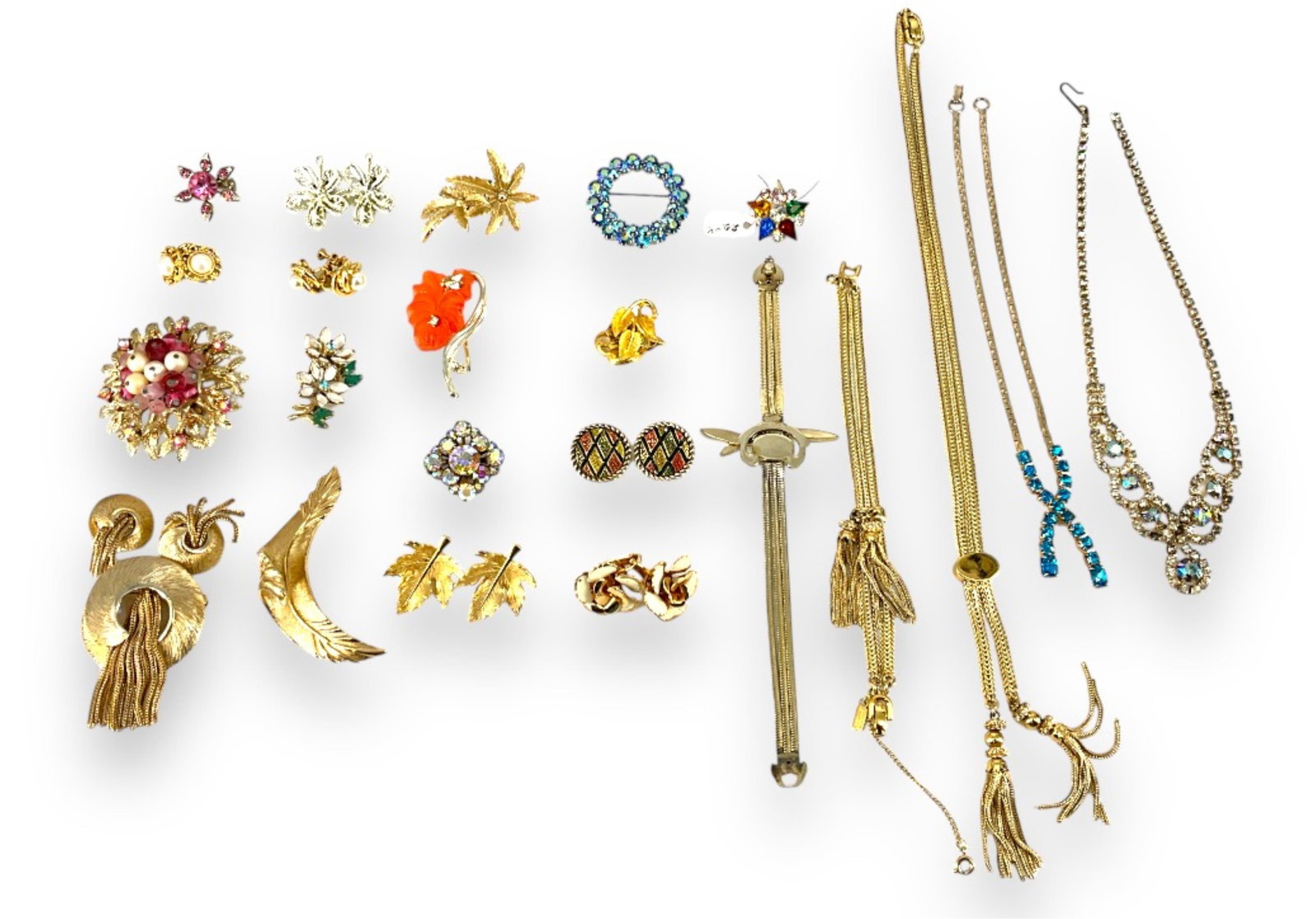 Lovely Vintage Fashion Jewelry Including Signed Pieces and Ones with Sparkling Crystals: Lovely Vintage Fashion Jewelry Including Signed Pieces and Ones with Sparkling CrystalsLot includes a lovely gold-tone curled-leaf brooch signed "Boucher" @ 3" wide, a signed gold-tone Coro circular b