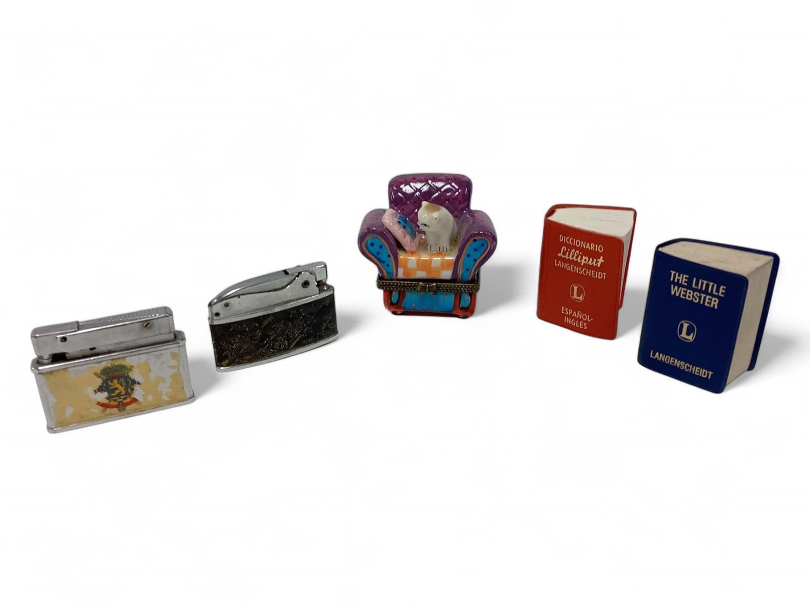 Lighters, Pill Box and Tiny Books: Lighters, Pill Box and Tiny BooksThe chair with cat pill box opens to reveal a pillow to put your pill on (see photo). The tiny books are Diccionario Espanol Ingles and The Little Webster and measure