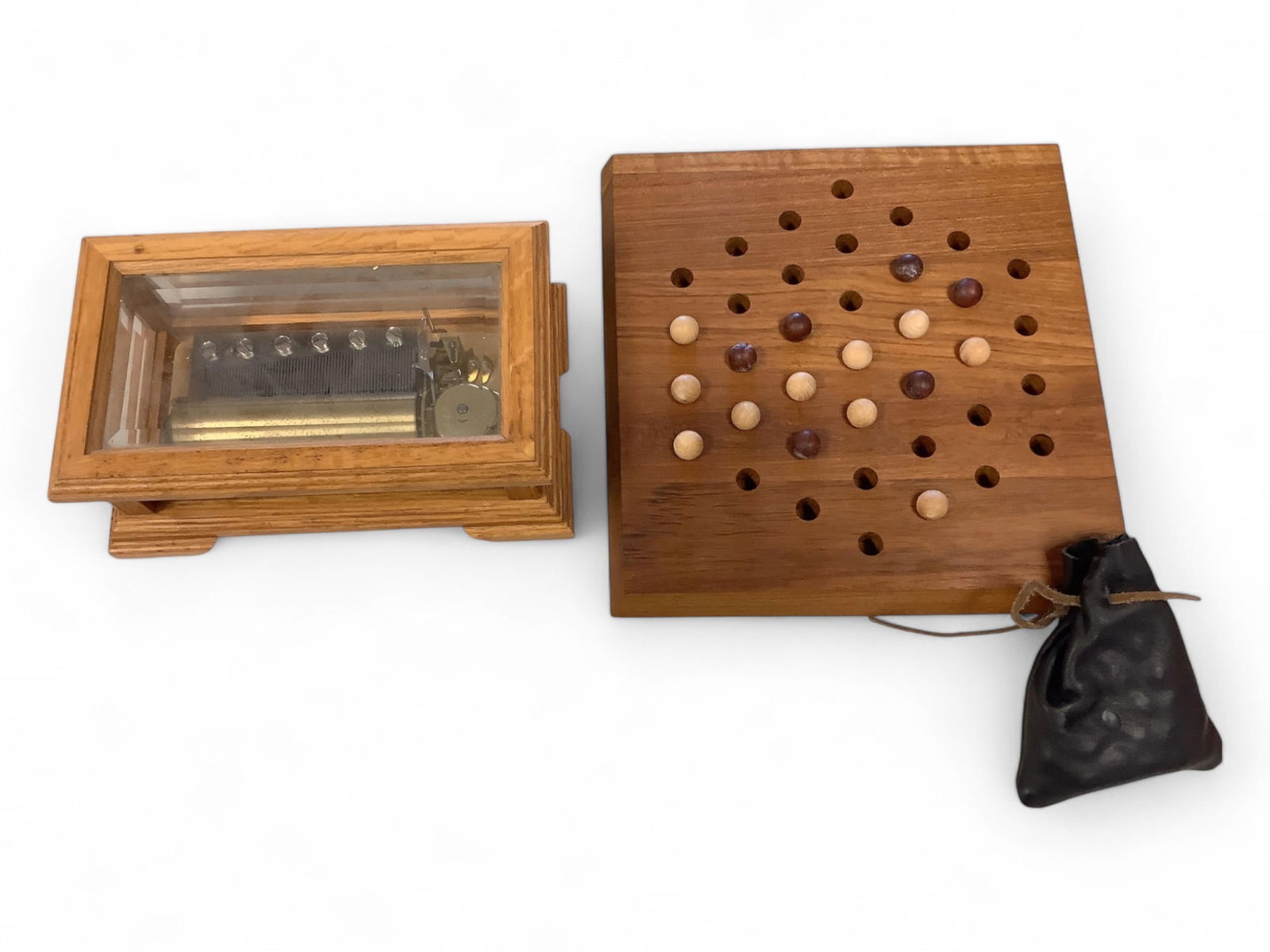 A Music Box By The San Francisco Music Box Company and a Vintage Board Game: A Music Box By The San Francisco Music Box Company and a Vintage Board GameThis lot contains The San Francisco Music Box Company music box playing romantic music. It measures approximately 9.0"W x 5.5