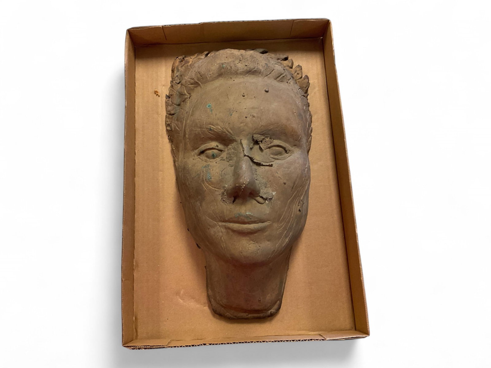Bronze Sculpture of a Face.: Bronze Sculpture of a Face. 14" L x 8.5" w Very heavy. No in-house shipping