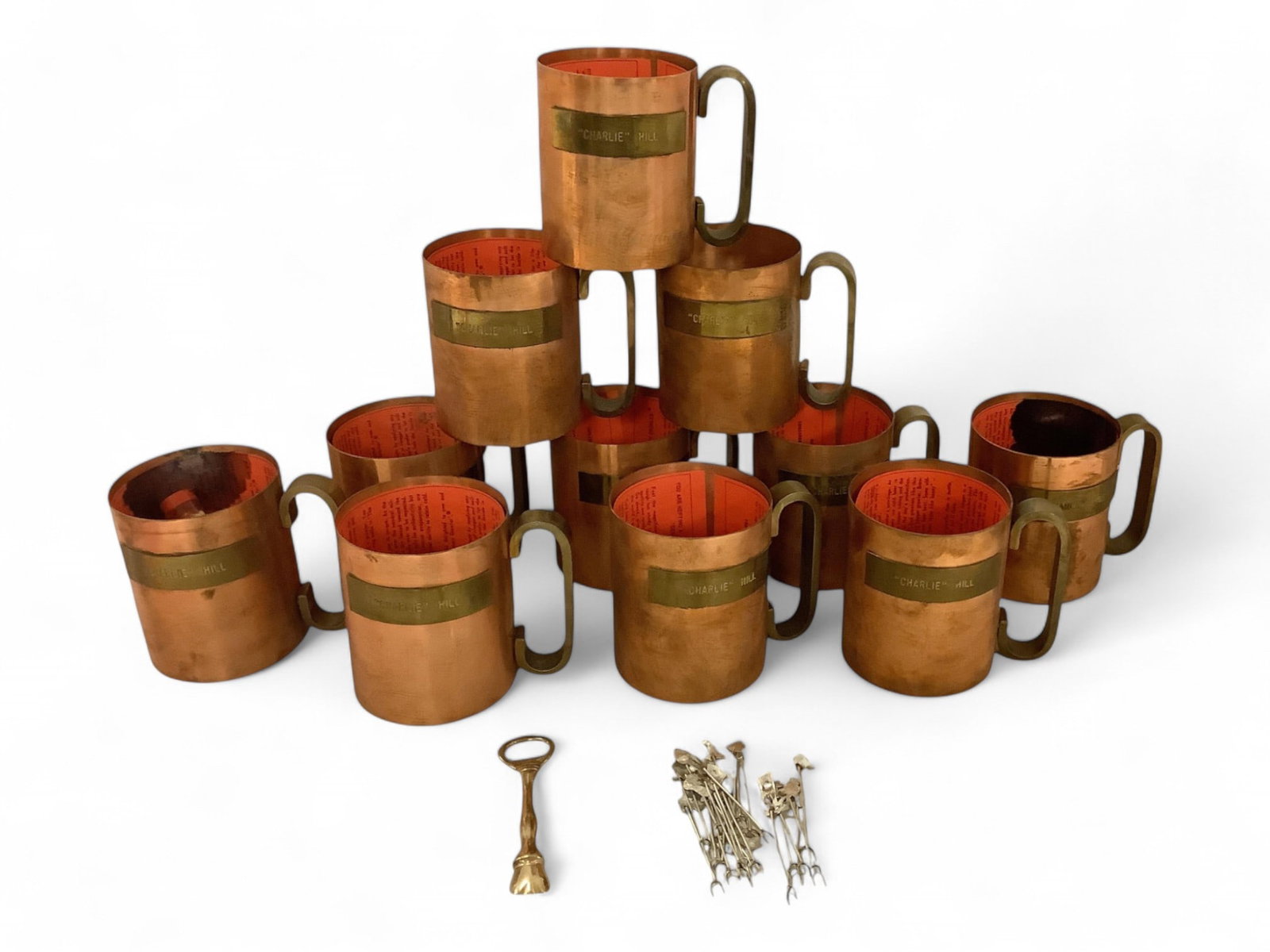 Genuine Copper Brewery Growlers 5 in. (12.7 cm.): Genuine Copper Brewery Growlers All (11) mugs have plates with "Charlie Hill" engraved on them. Also included are (24) hors d'oeuvre picks. Made in Niles, Oh. 5 in. (12.7 cm.)