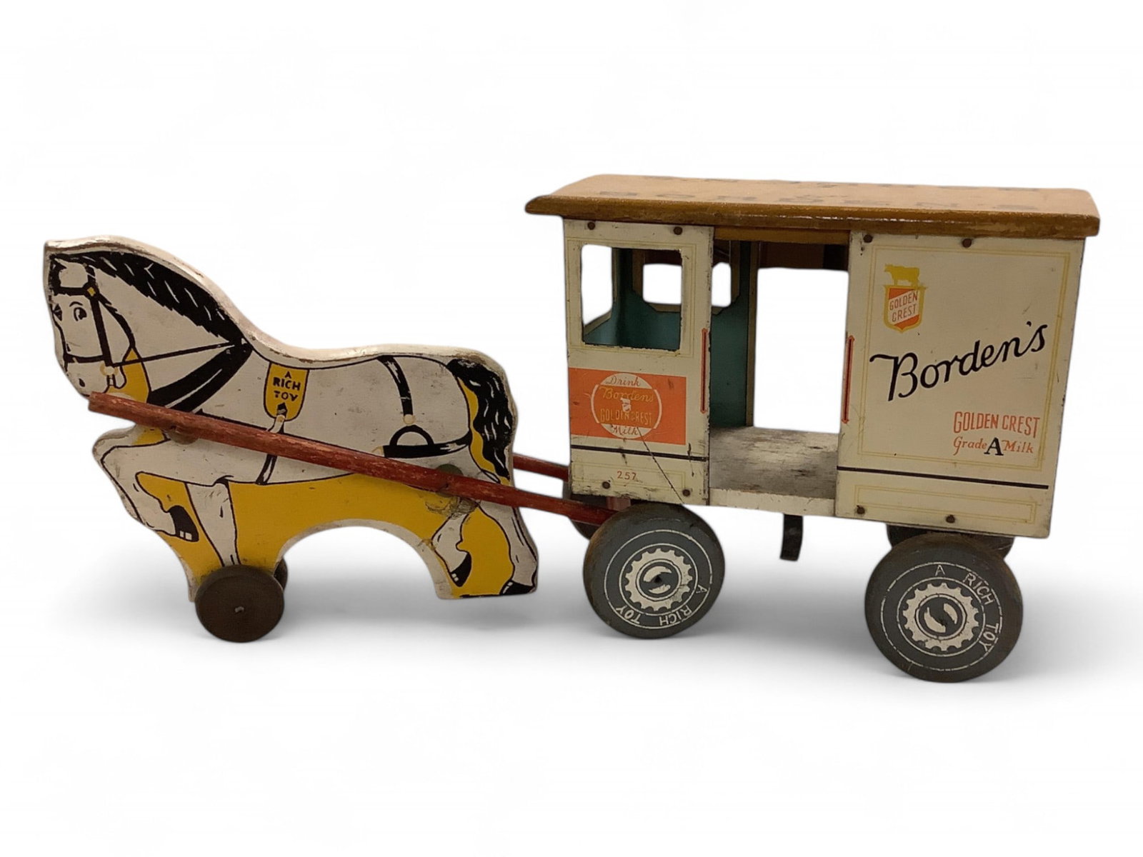 Vintage Metal & Wood Rich Toy Borden's Milk Cart & Horse Overall length is 17.5": Vintage Metal & Wood Rich Toy Borden's Milk Cart & HorseMetal cart detached from wooden horse.Overall length is 17.5"