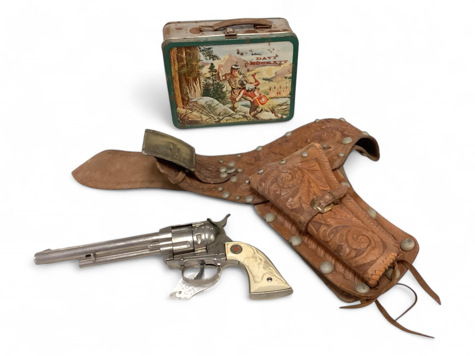 Holtemp Davy Crockett Lunch Box, Hubley Cowboy Cap Gun and Cap gun is 11" long: Holtemp Davy Crockett Lunch Box, Hubley Cowboy Cap Gun andCap gun has Longhorn Steer on white plastic grip.Cap gun is 11" long