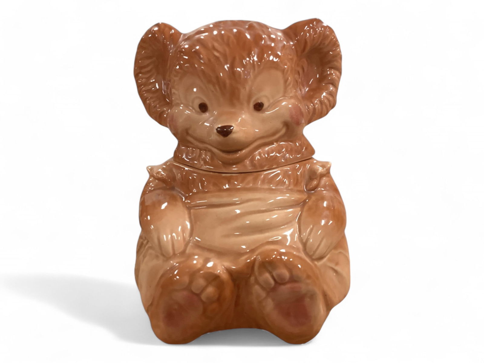 Vintage Bear Cookie Jar: Vintage Bear Cookie JarA vintage bear cookie jar measuring approx 11.0"H and having an angular shaped opening. (Length 5.0" see photo). See photo also for markings on bottom.