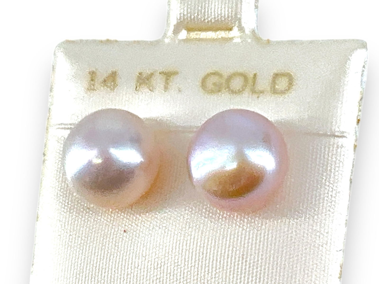 Pearl Stud Earrings with 14kt Gold Backings: Pearl Stud Earrings with 14kt Gold Backings10.75mm in diameter, off-white body color with a pink hue, ft. strong luster and great nacre quality. Pierced style on 14kt yellow gold posts.