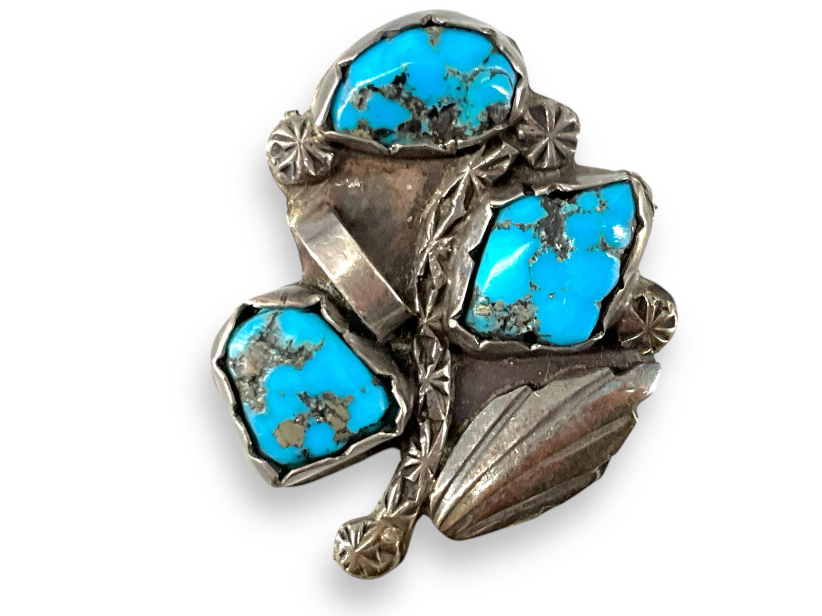 Southwestern Sterling Silver and Turquoise Stone Brooch: Southwestern Sterling Silver and Turquoise Stone Brooch Signed AMTY in script lettering, tested sterling silver/925, with turquoise stones in bezel settings measuring up to 12.5mm in size, 0.20 troy o