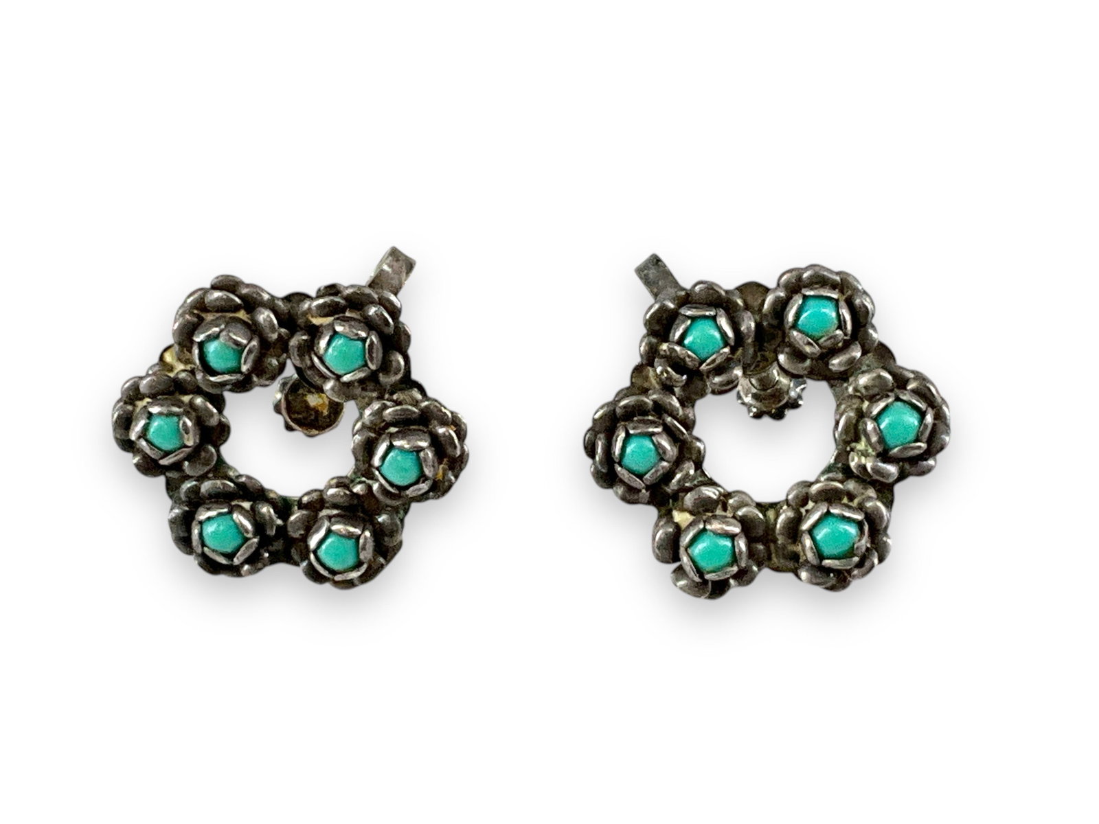 Pair of Sterling Silver and Turquoise Stone Earrings: Pair of Sterling Silver and Turquoise Stone Earrings Stamped and tested sterling silver/925, screw-back closures, 20.5mm in diameter, floral wreath design set with small round-shape turquoise stone ca